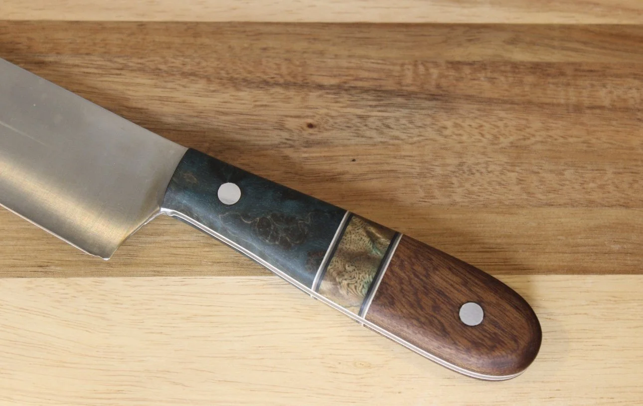 Close-up of a kitchen knife with a wooden handle