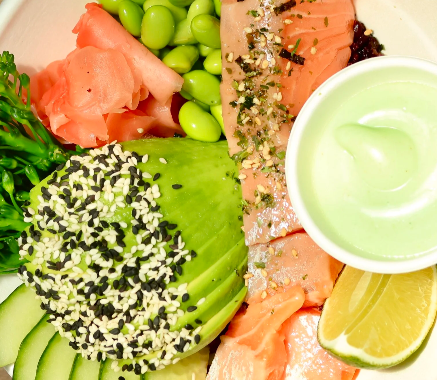 poached king salmon from New Zealand, avom edamame, pickled ginger, ponzu black rice and a side of wasabi mayo