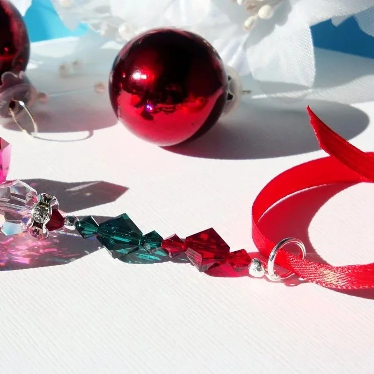 small+angel+ornament+red+and+green+laying+down.jpg