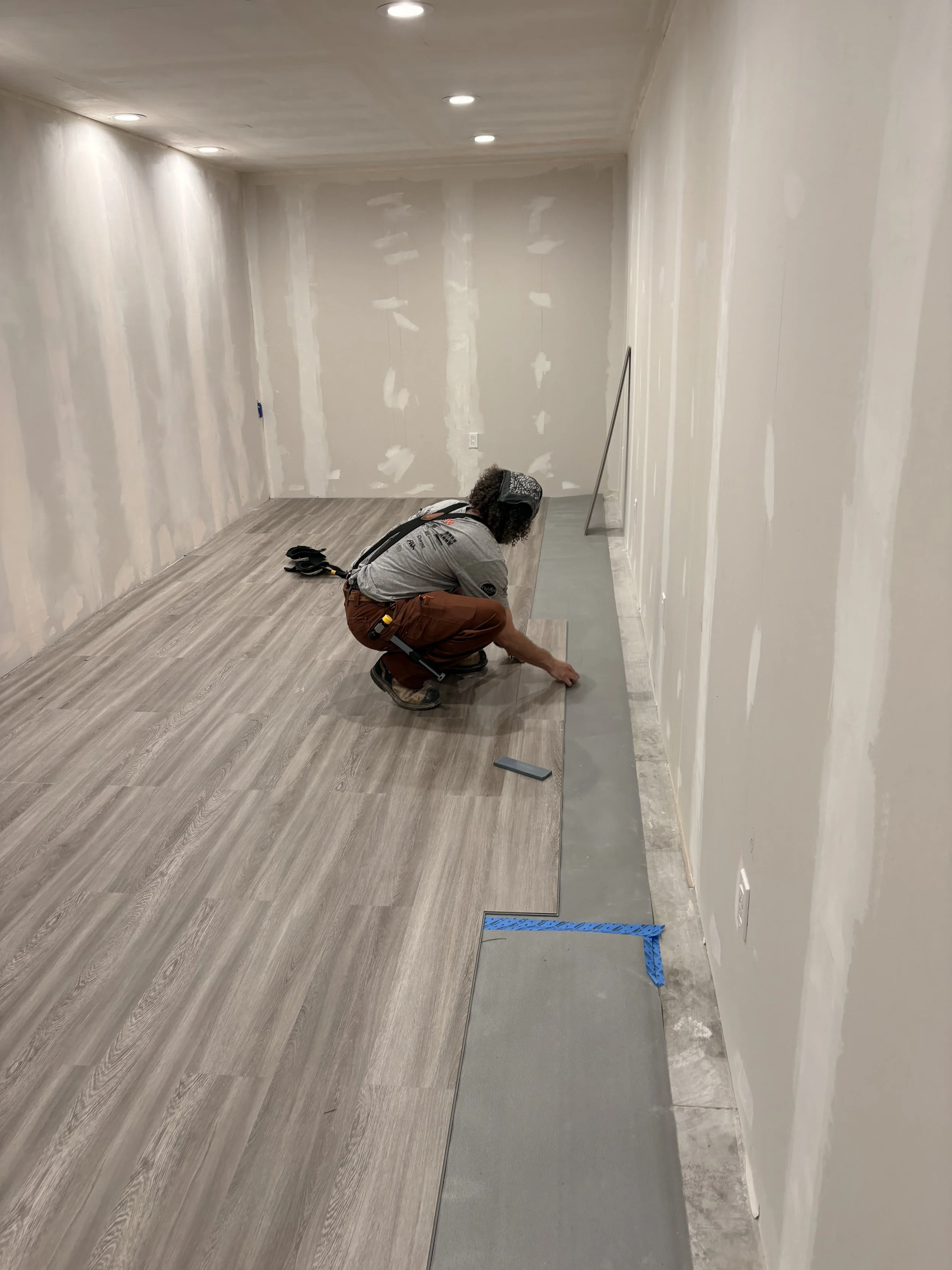 John installing LVP in a Pueblo West basement