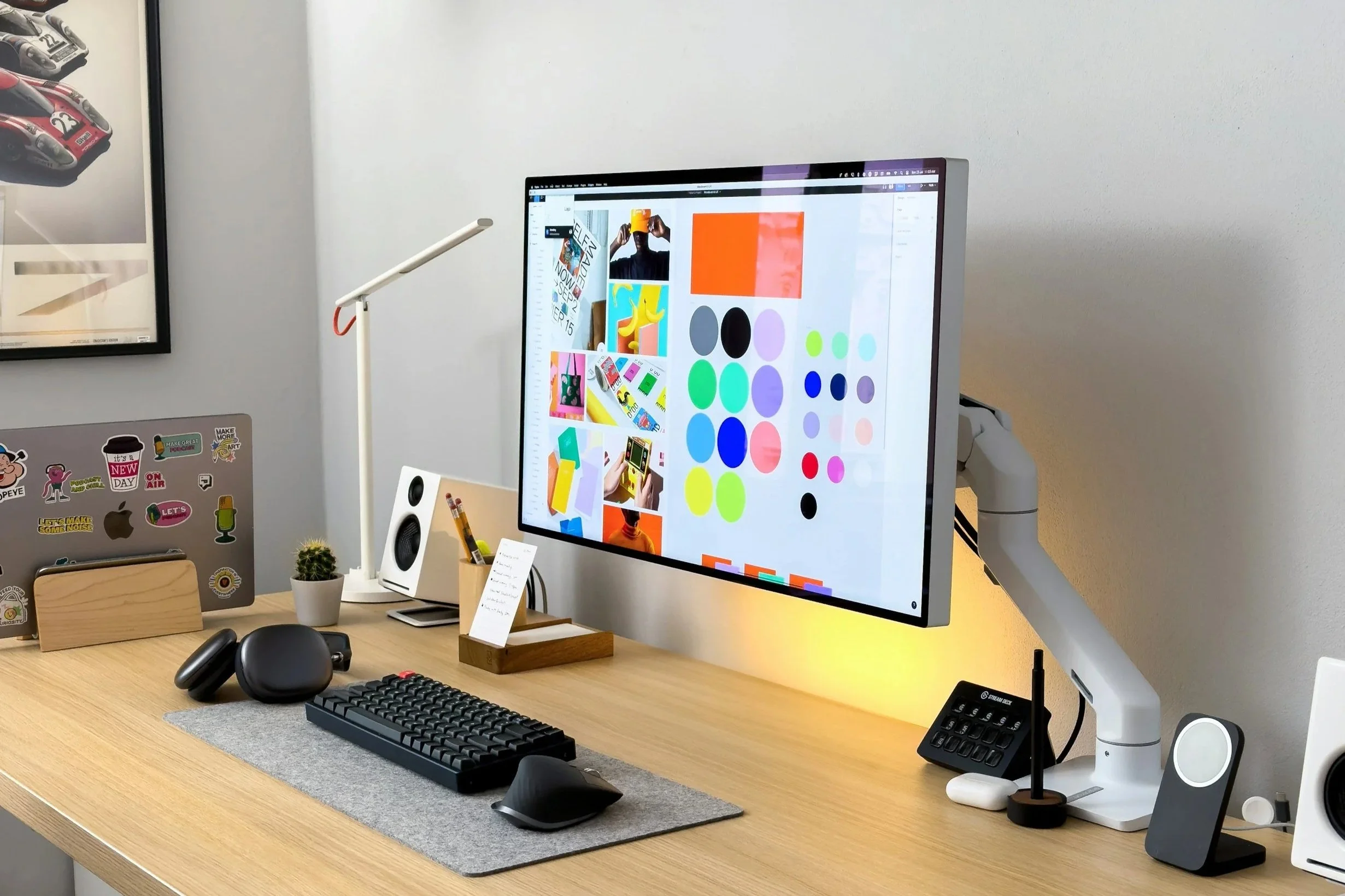 Graphic designer’s workspace with brand colour palettes, digital editing tools, and creative assets — representing Arrow’s data-informed graphic design services focused on clarity, consistency, and measurable impact.