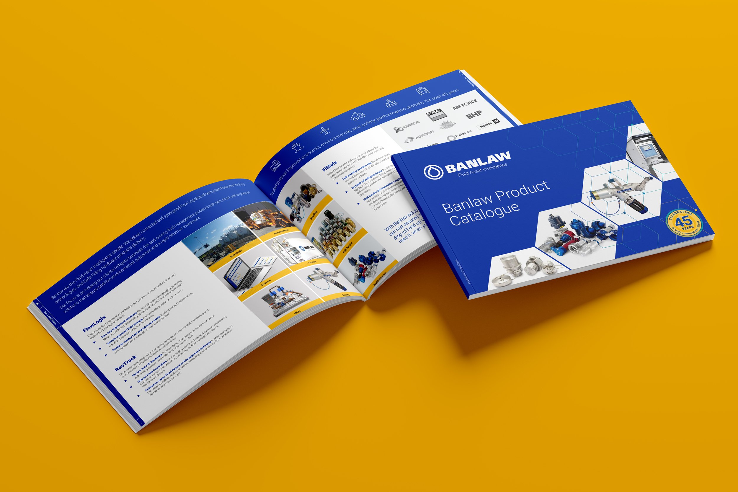 Open and closed Banlaw Fluid Asset Intelligence catalogues showcasing Arrow’s graphic design, content production, and product marketing services.