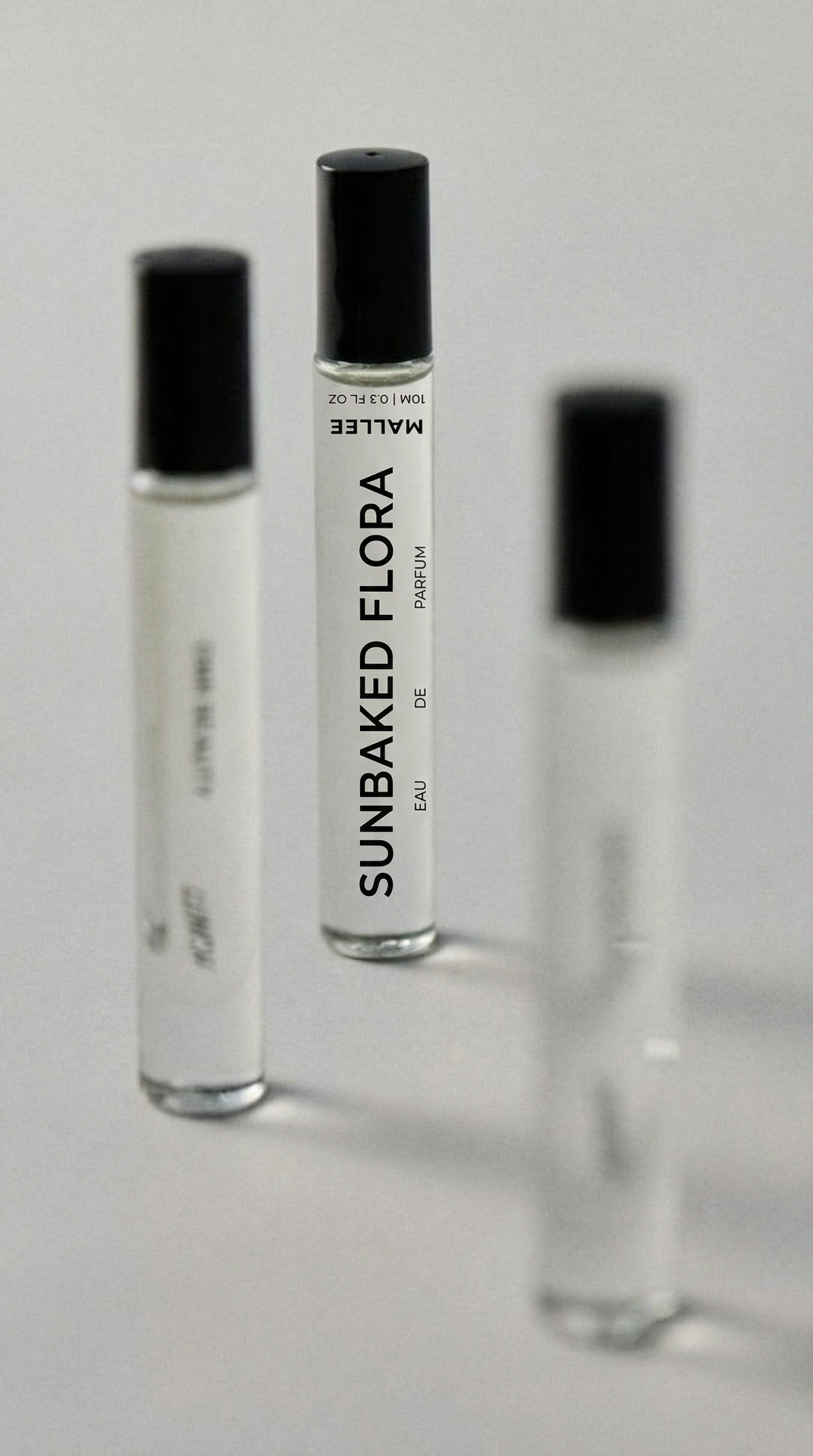 Generated with Kive.ai - can you recreate a similar reference style image using my perfume label (transparent) (1).png