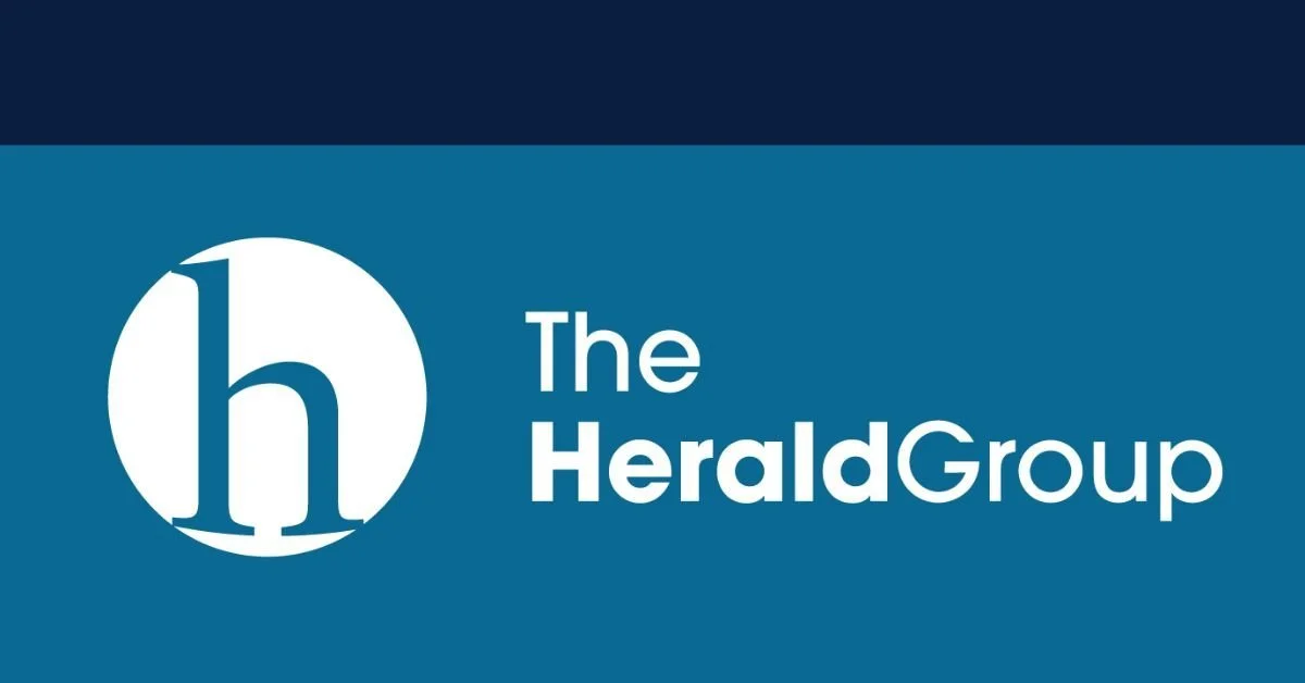 The Herald Group logo featured on a vibrant blue backdrop.