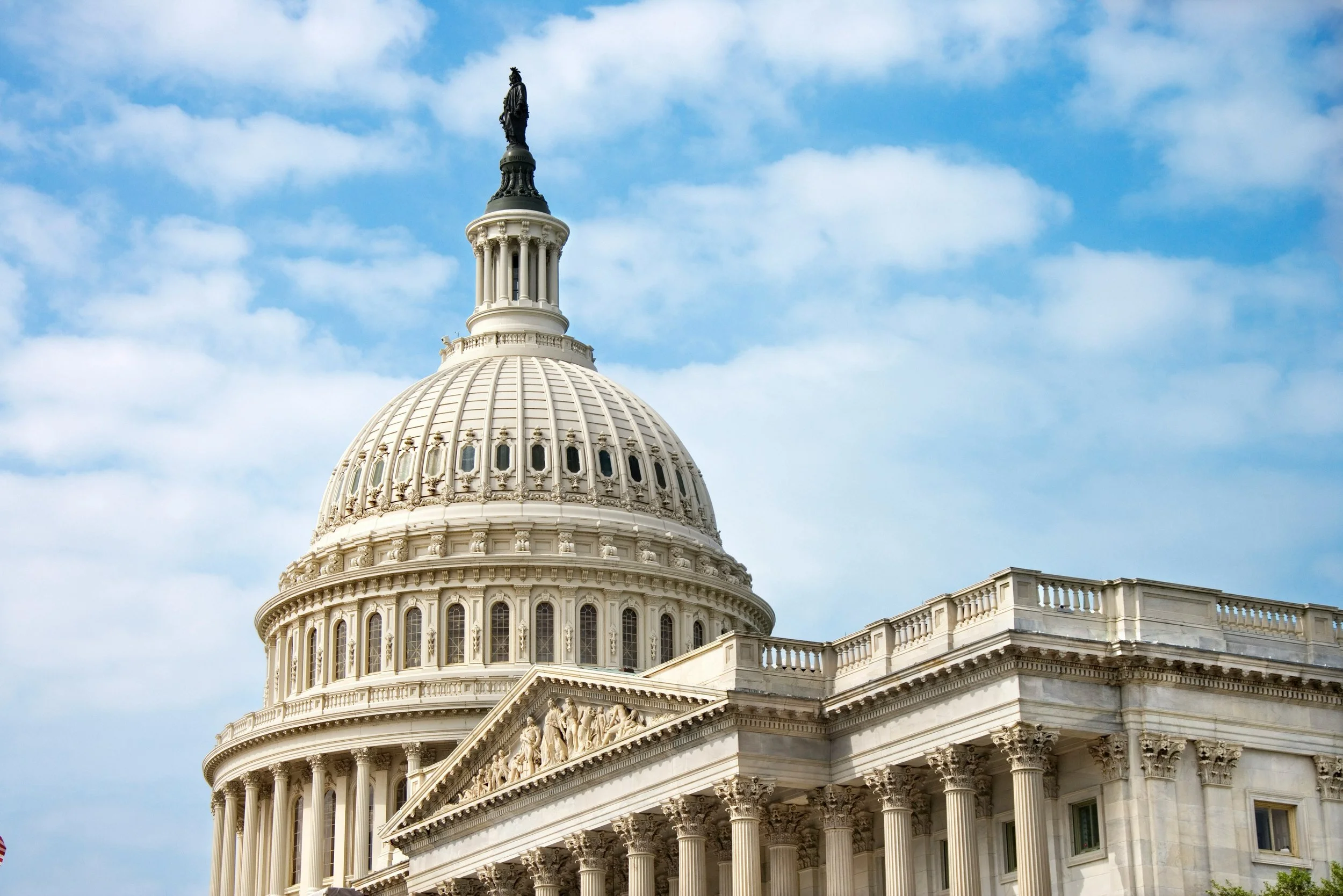 The U.S. Capitol building stands prominently in Washington, D.C., showcasing its iconic dome and neoclassical architecture.