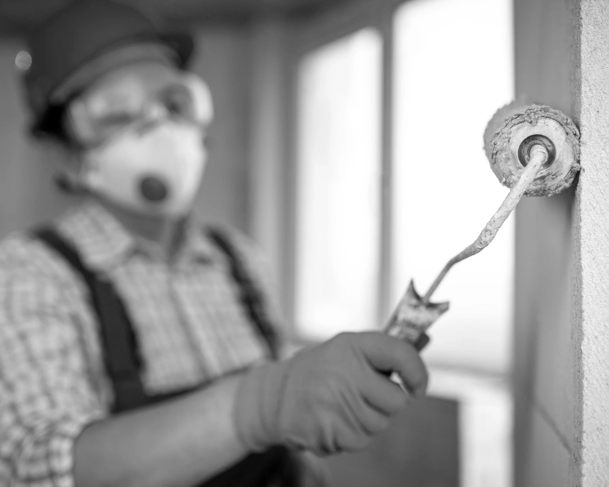 female-construction-worker-with-helmet-paint-roller.jpg