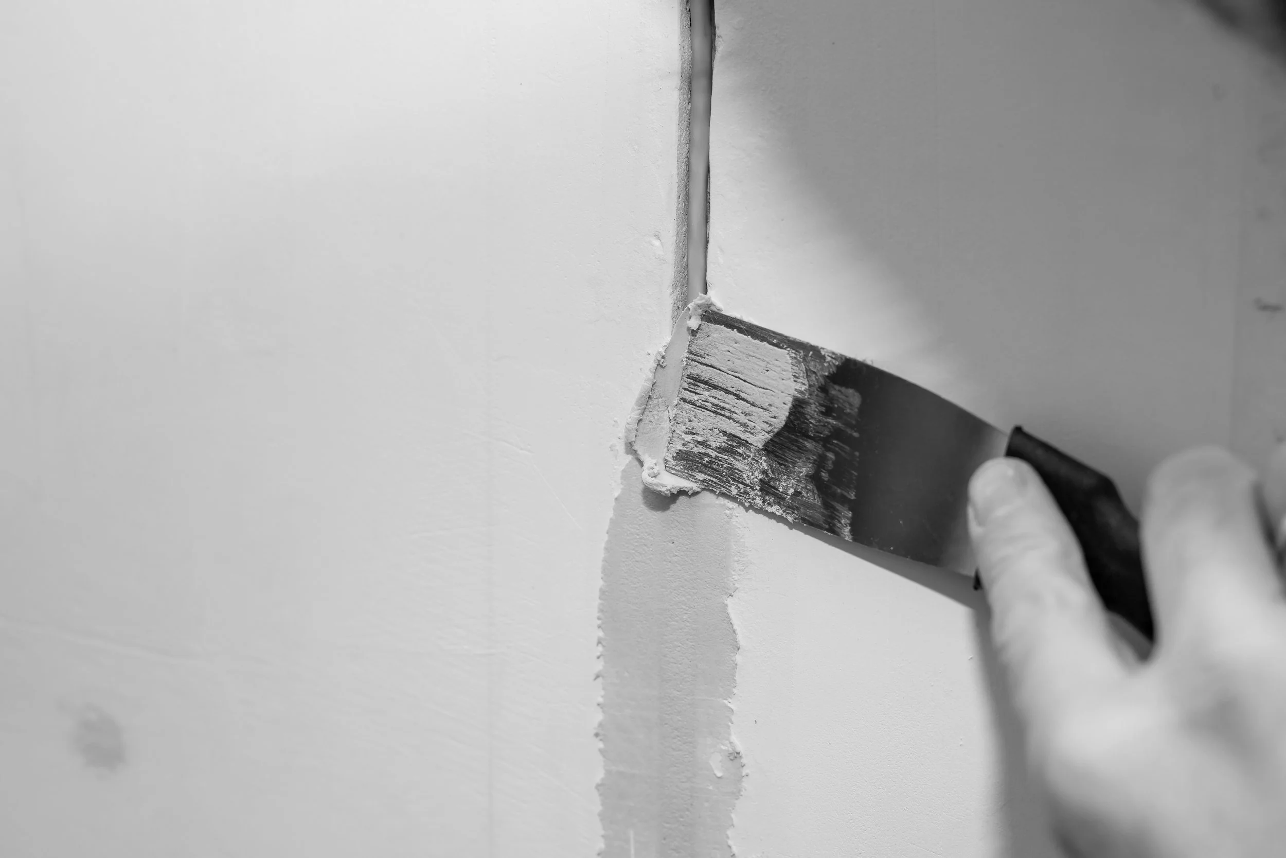worker-fixing-cracks-ceiling-spreading-plaster-using-trowelplastering-cement-wall.jpg