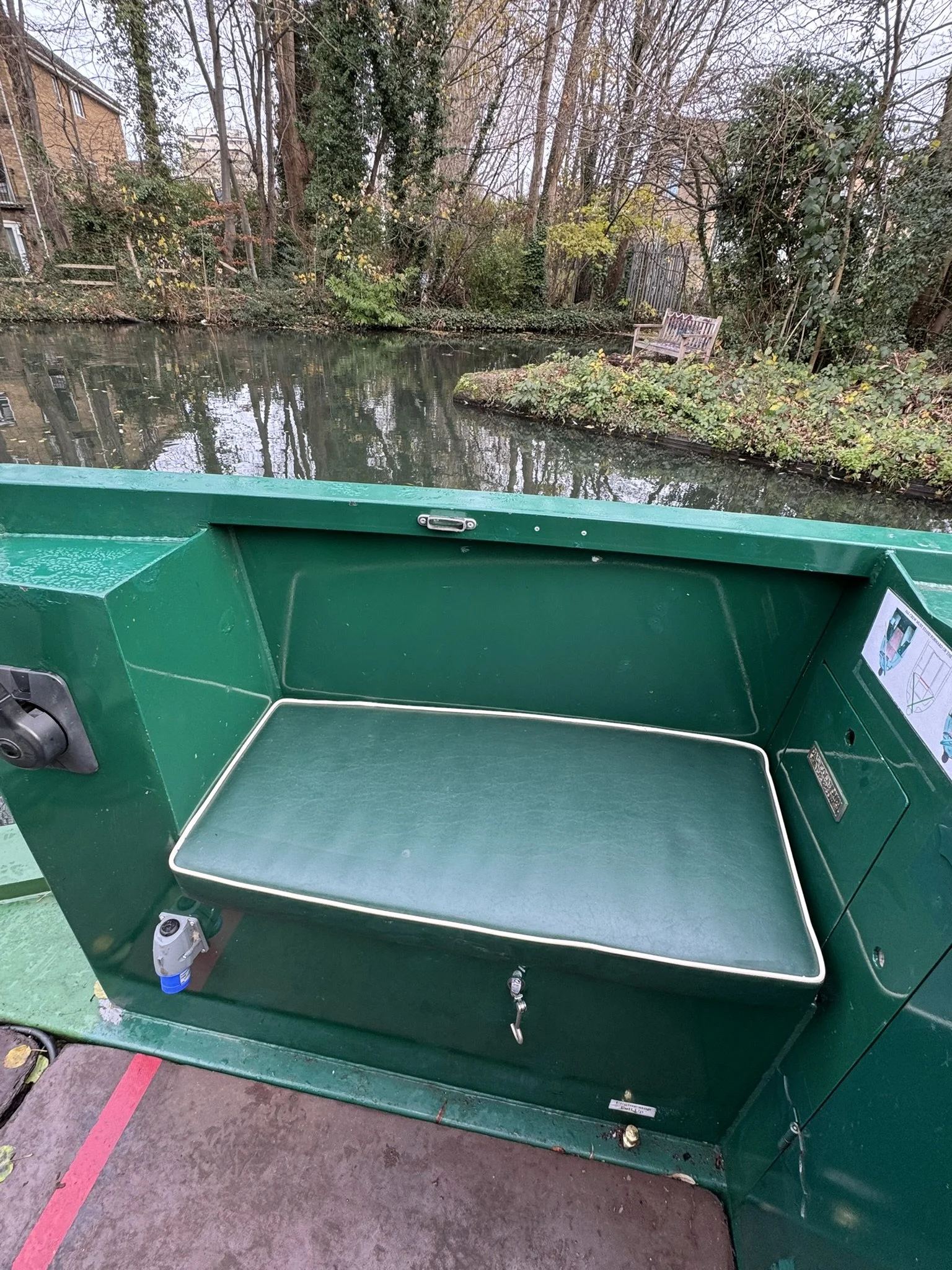 Padded seating area at the rear of the boat