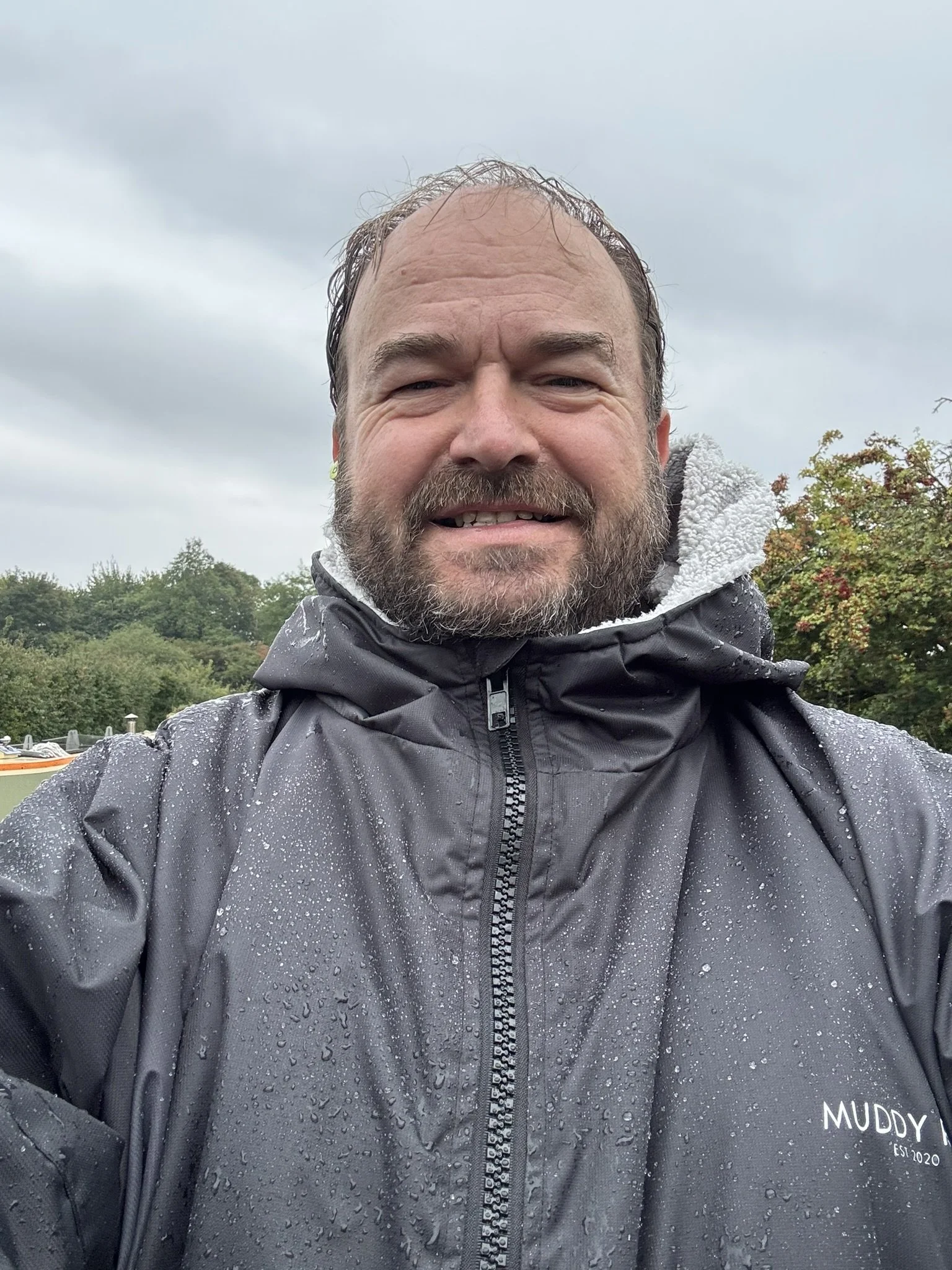 Steering a canal boat in the rain