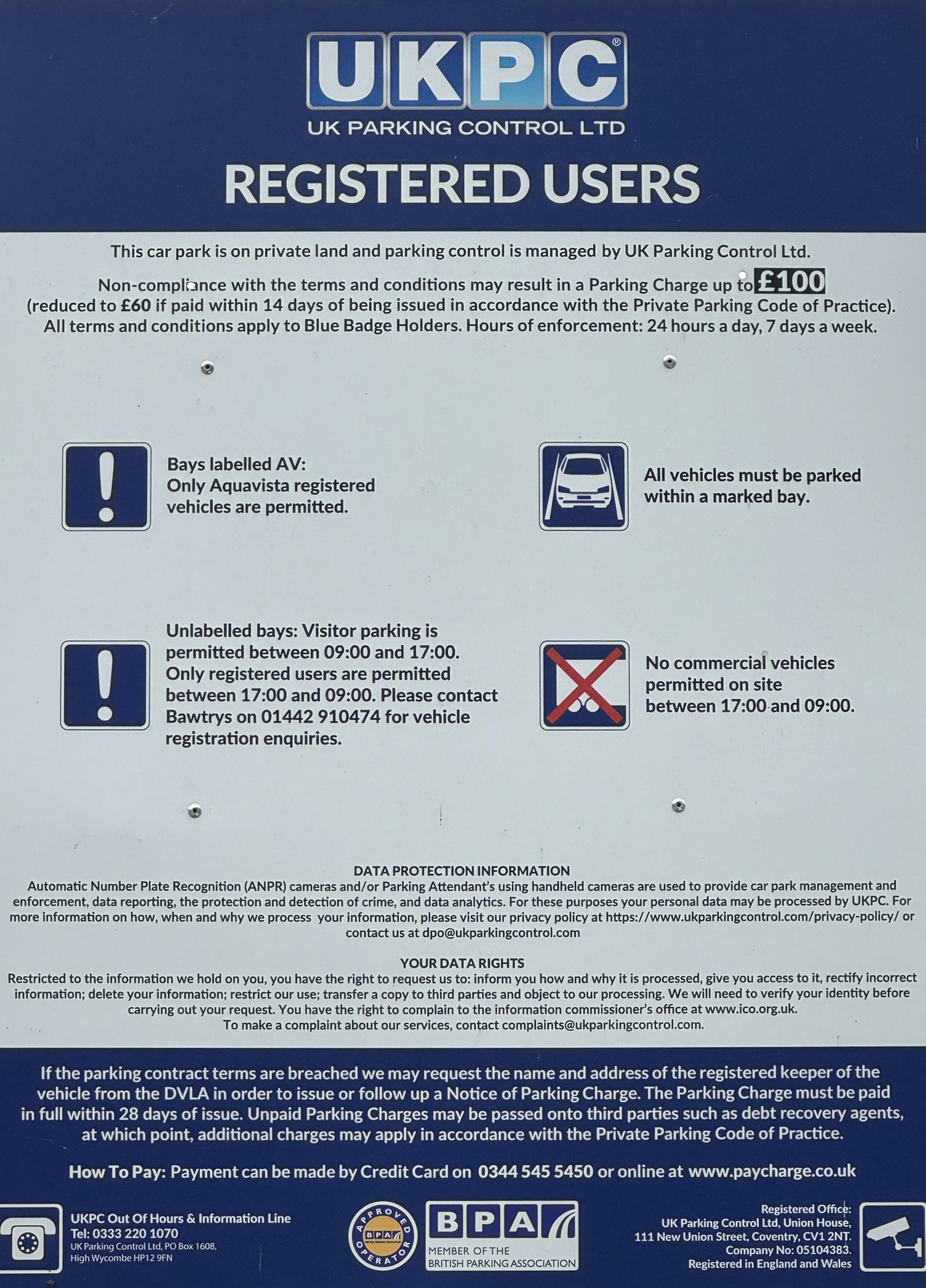 Parking control sign for UK Parking Control Ltd. for registered users, indicating rules for parking bays, visitor bays, and restrictions on commercial vehicles, with information on data protection and payment options.
