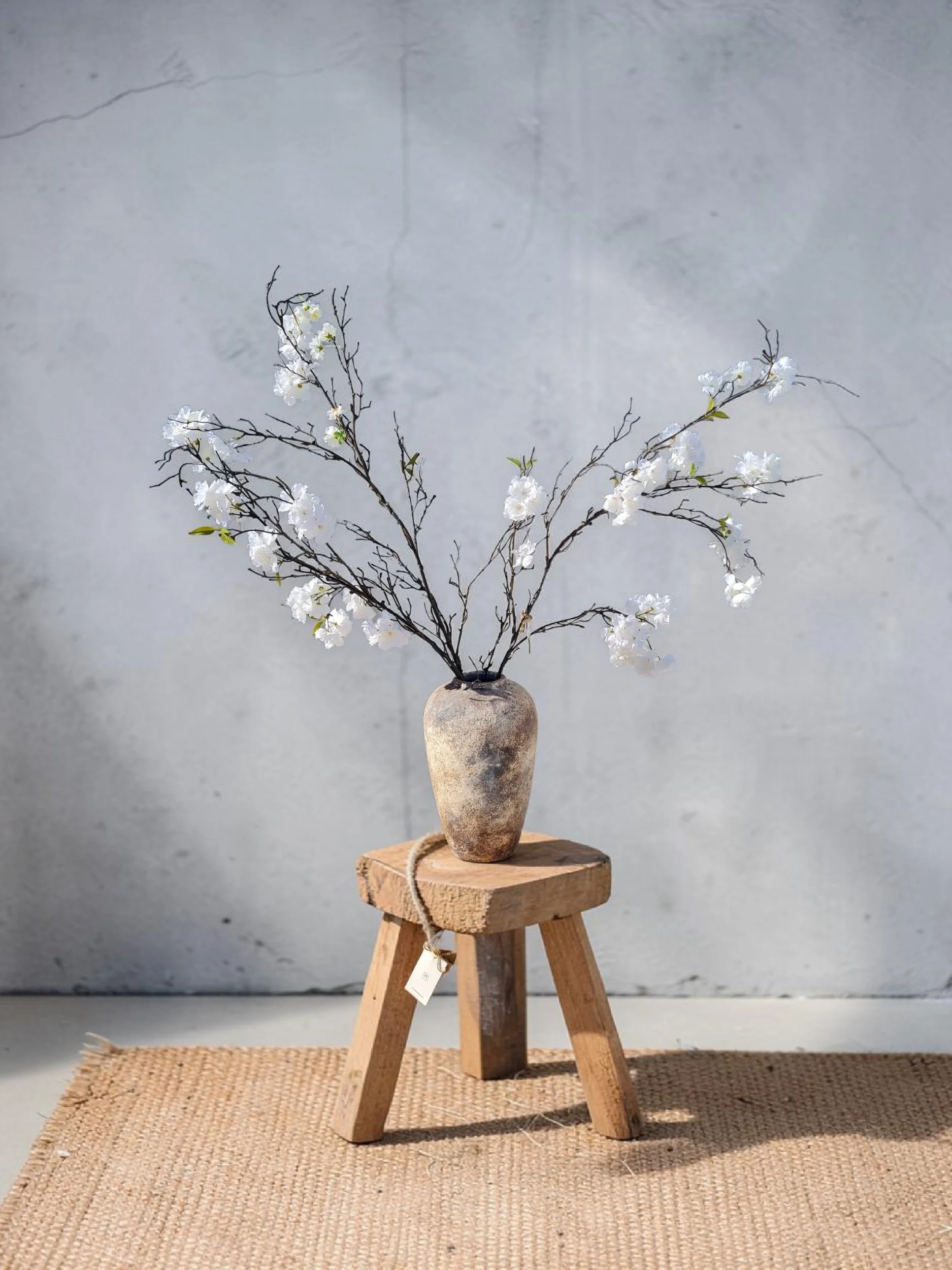 Rustic vase with white blossom
