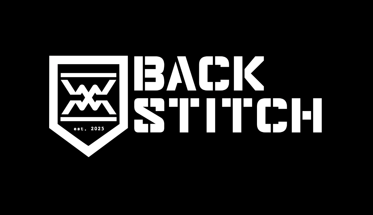 Black and white logo with a shield and geometric design, text reads "BACK STITCH" and "est. 2025".