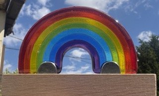 Glass rainbow on Oak presentation stand.