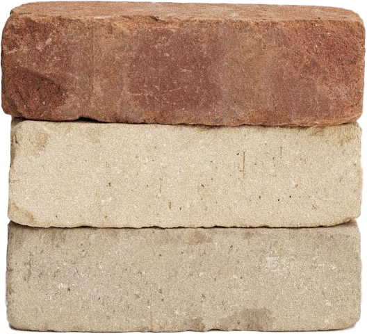 Close-up of three different colored stone bricks, stacked horizontally.