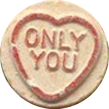 A round cookie with icing that reads "ONLY YOU" inside a heart outline.