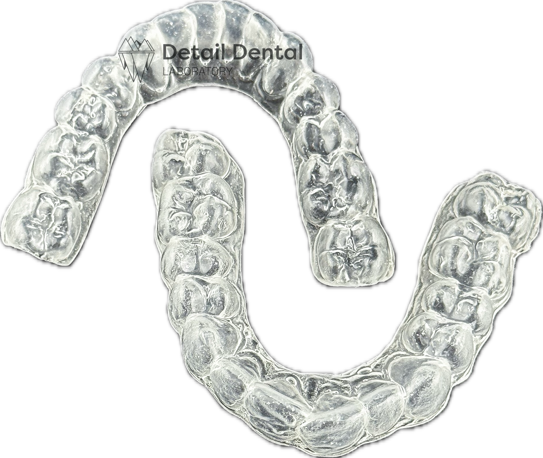 A clear dental aligner with the logo and name 'Detail Dental Laboratory' on a black background.