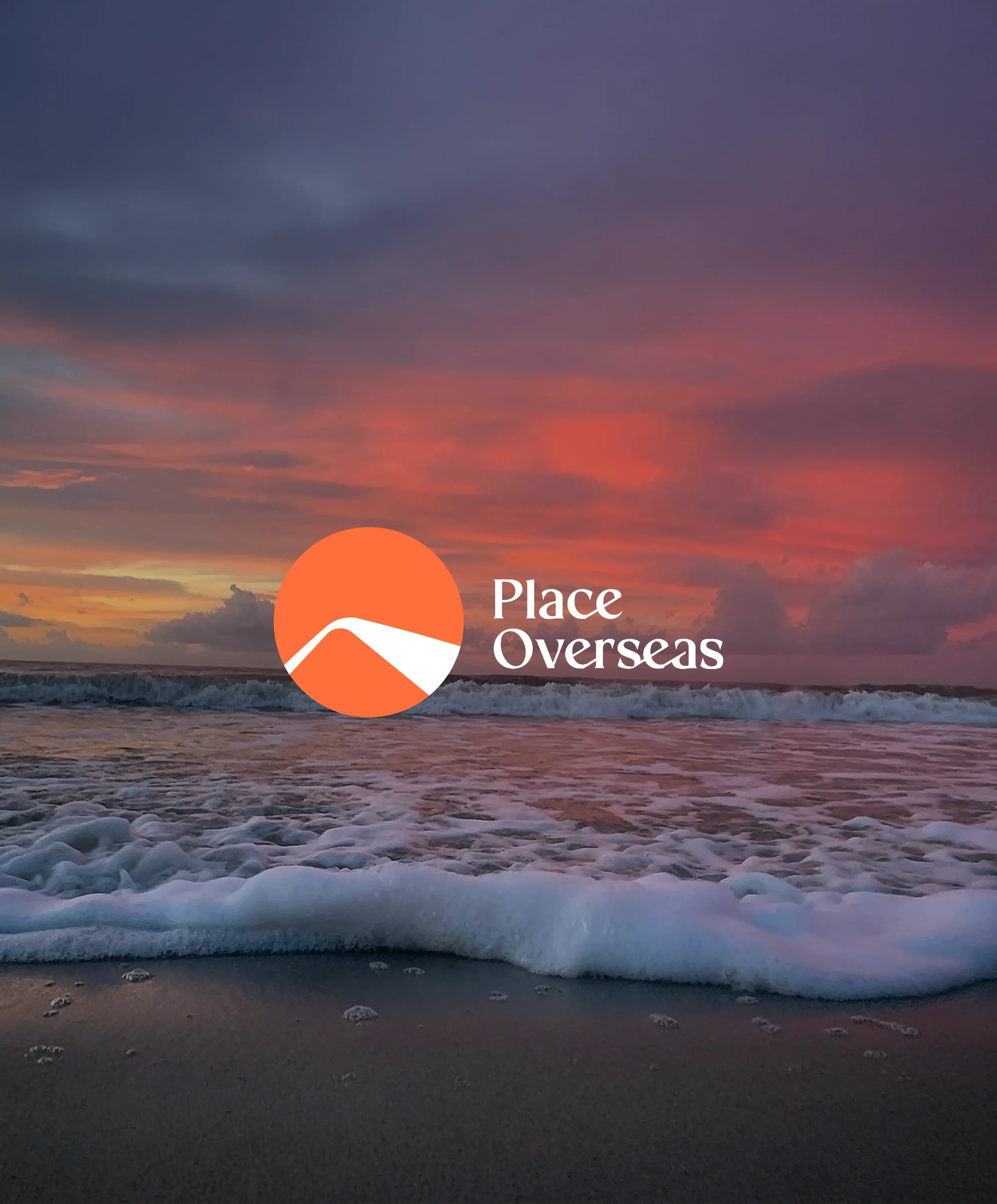 Sunset over the ocean with colorful pink, purple, and blue sky and waves hitting the shore, featuring a logo of an orange circle with a white mountain and the text 'Place Overseas'.