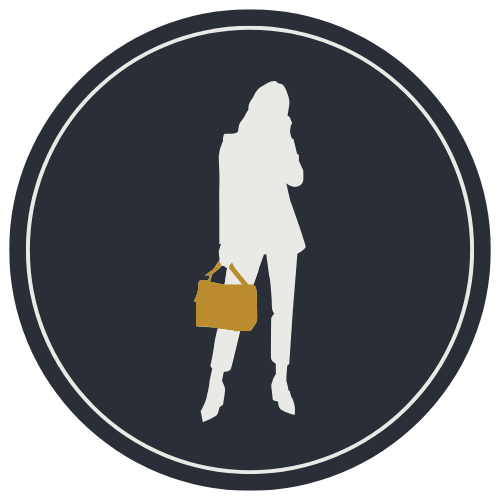 Silhouette of a woman standing and reading a tablet or book.