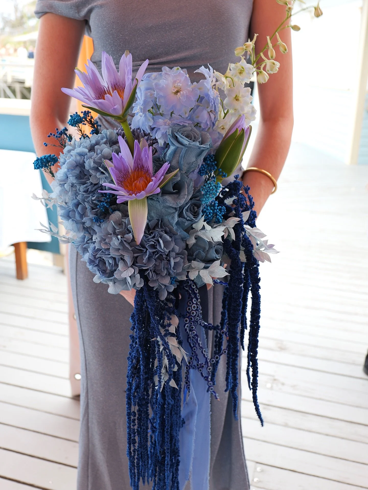 Something blue, but layered with meaning 🌊🧿

This bridesmaid bouquet was designed to echo the depth and movement of the ocean &mdash; inky blues, soft periwinkle tones, sculptural layers and flowing textures that feel both romantic and bold.
Woven 