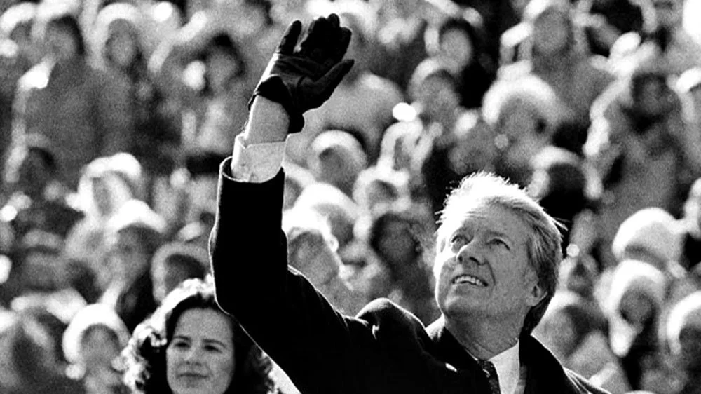 Jimmy Carter waving to crowds during his inaguration. (AP Photo/Suzanne Vlamis, File)