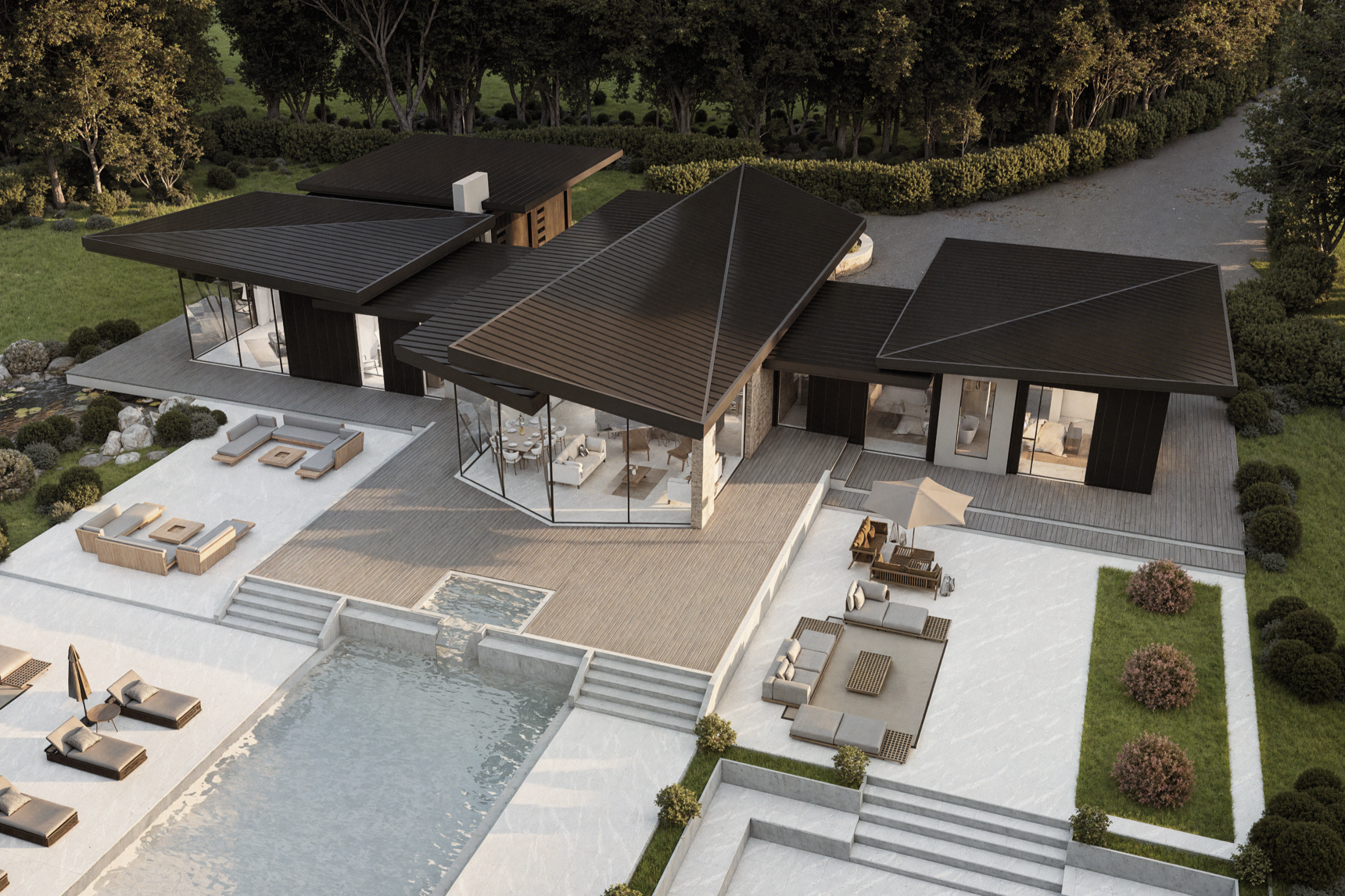 A modern house with black metal roofs, large glass windows, surrounded by greenery and an outdoor pool with lounge chairs and seating area.