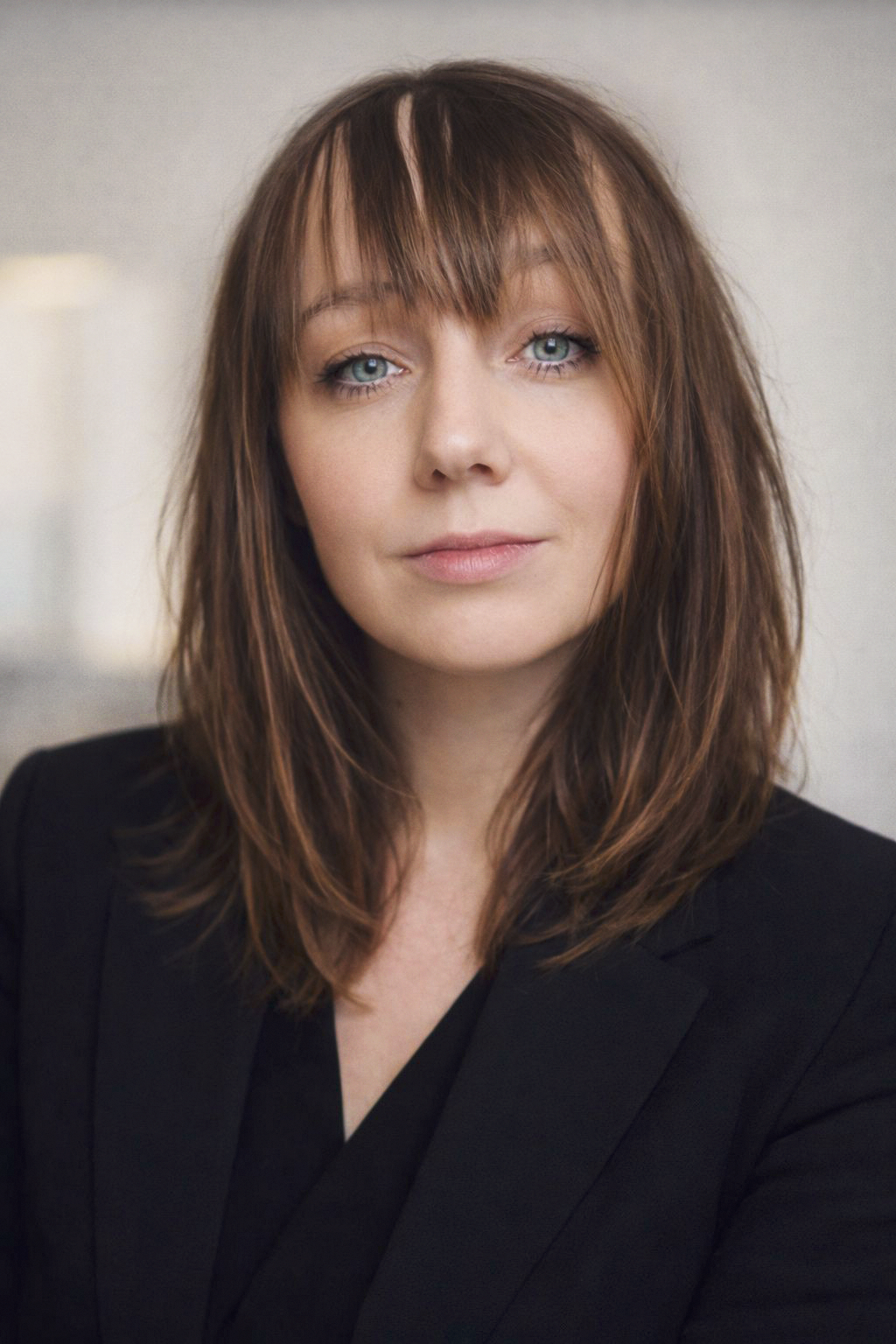 Portrait of Maria Jonecko, CCO of Stavrok, wearing a dark blazer and looking directly at the camera with a composed and thoughtful expression.