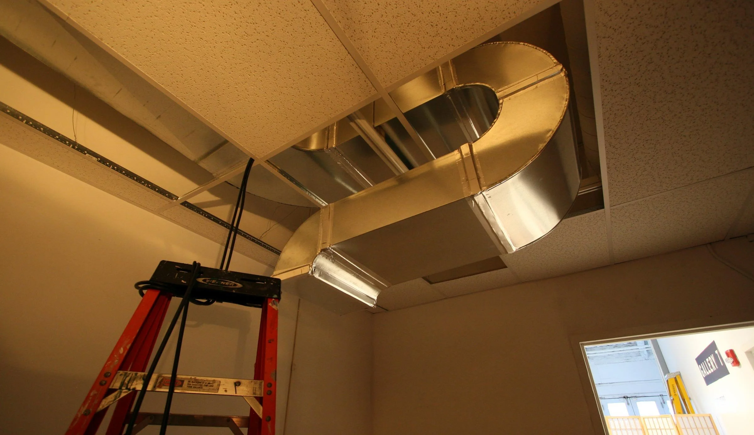 Ducts curl and wrap around the building infrastructure.