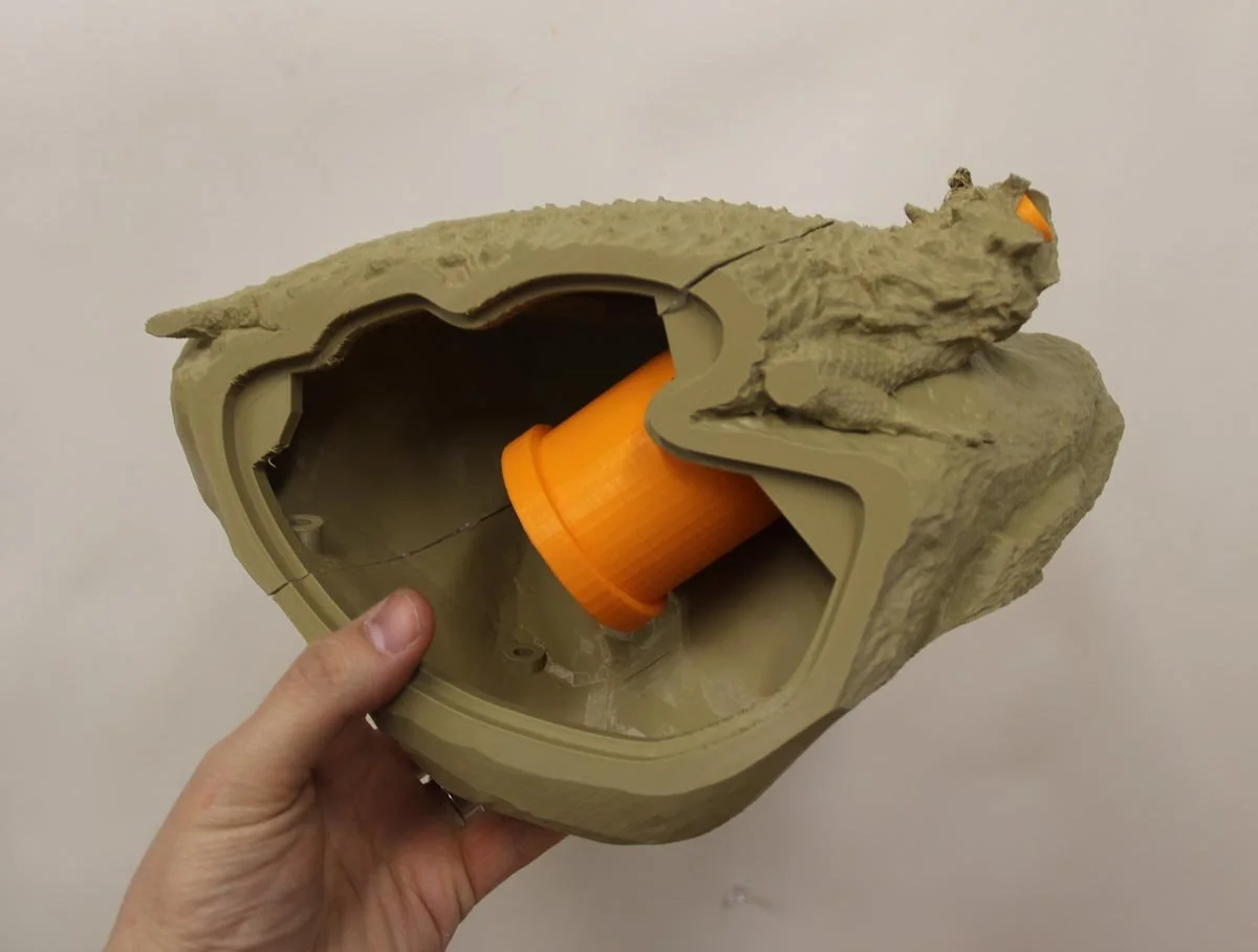 Test 3D prototype of the horned lizard and display housing. Getting all the parts to fit inside these small castings was a significant design challenge.