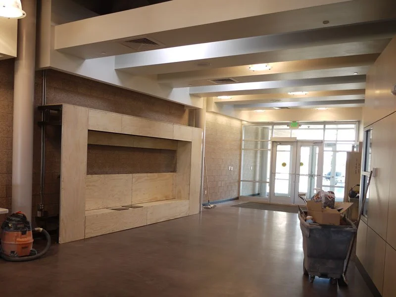 Bolting to the wall and skinning with plywood