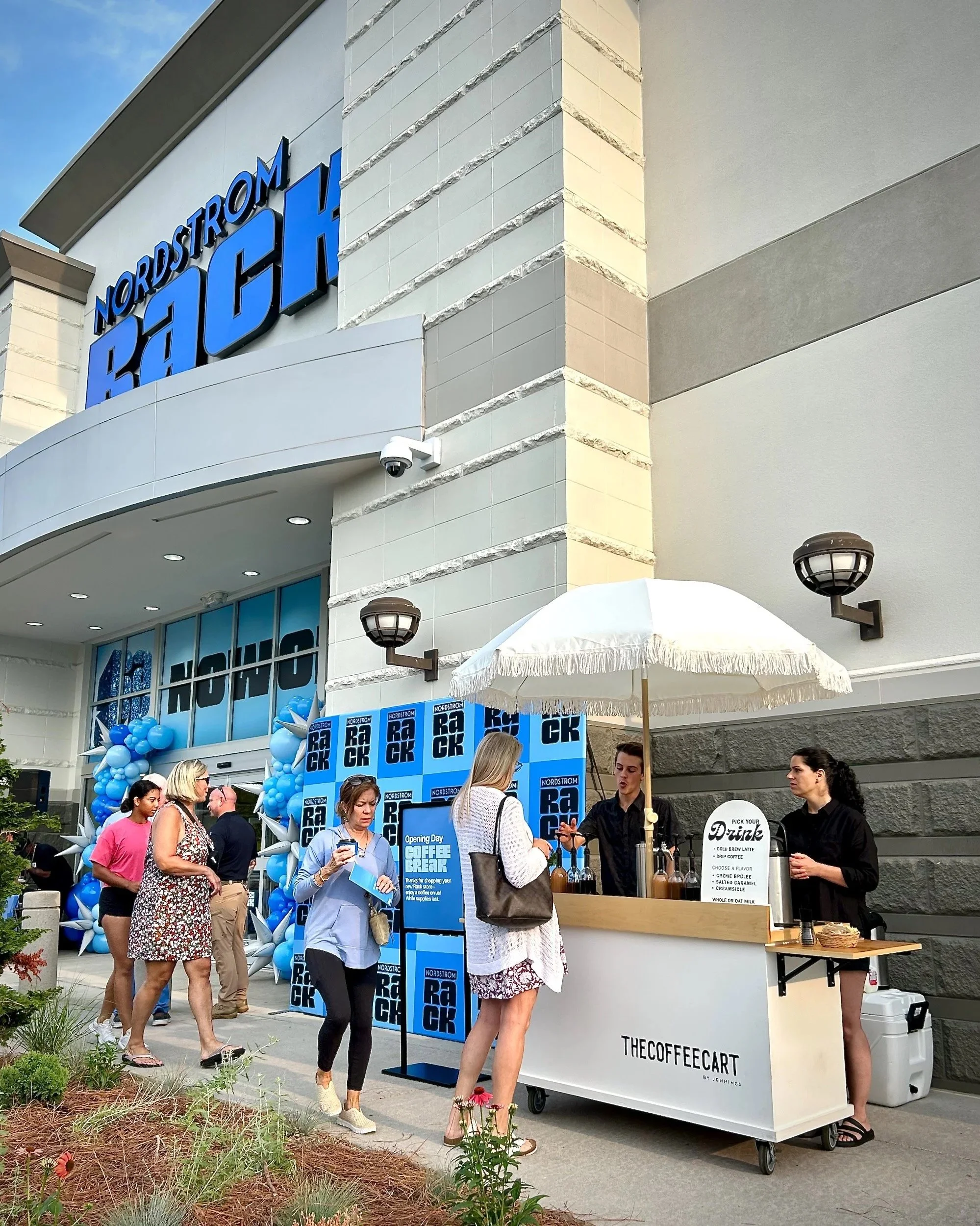 Guests lined up at The Coffee Cart's mobile coffee bar during a large-volume brand activation at the Nordstrom Rack grand opening in Knoxville.