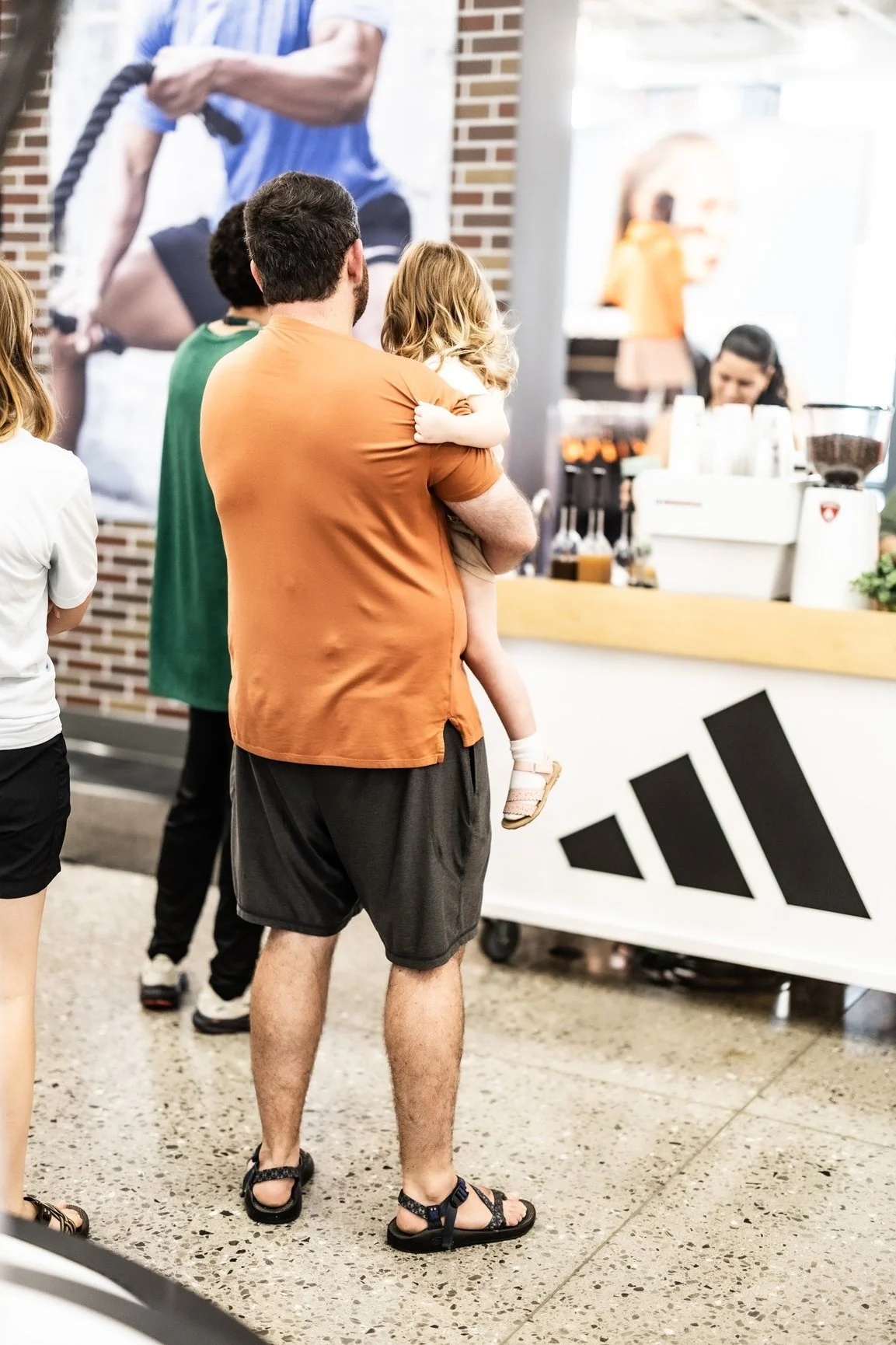Family in line at The Coffee Cart's Adidas activation at Dick's House of Sport in Knoxville.