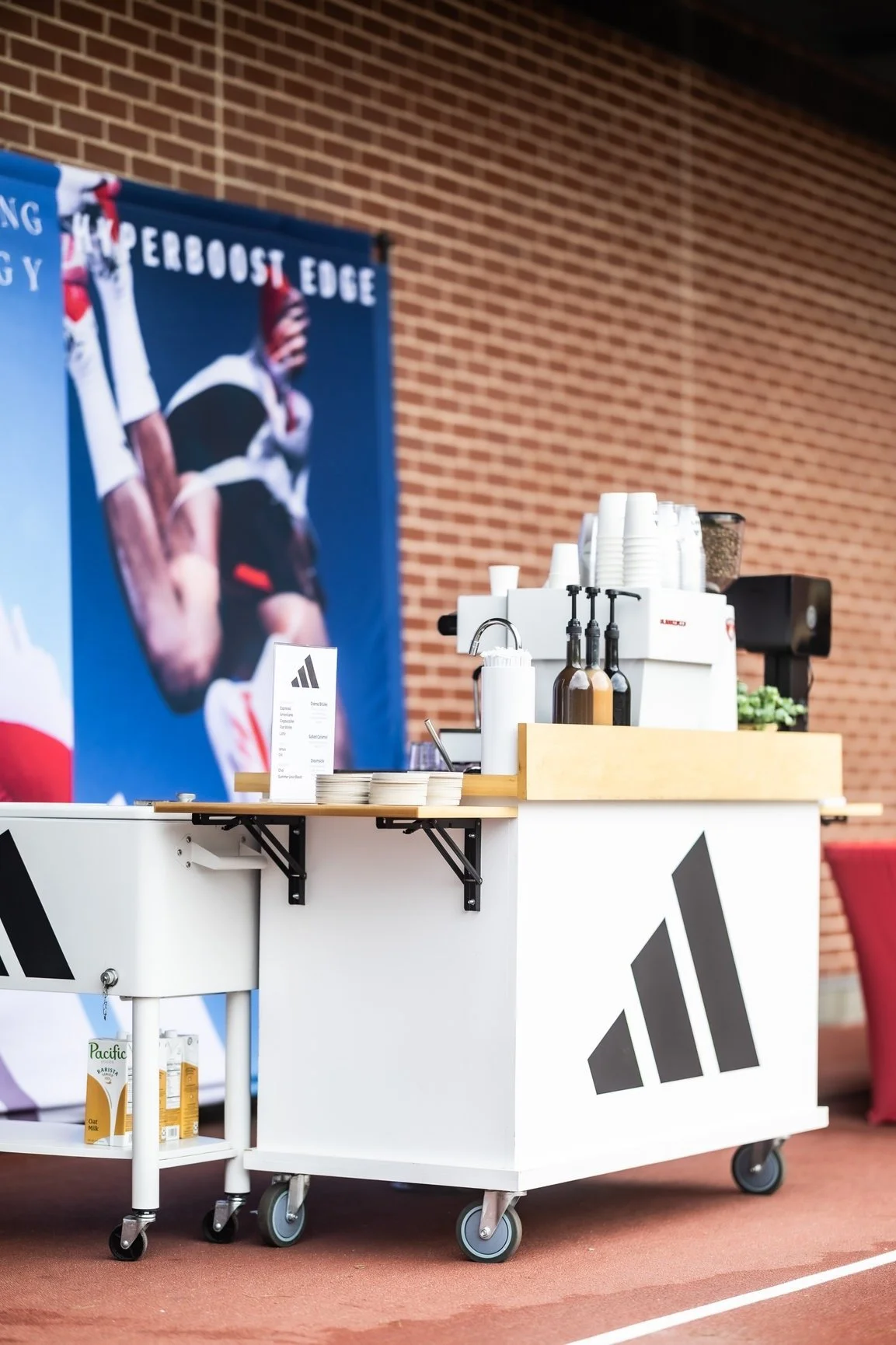 The Coffee Cart's Adidas-branded mobile coffee stand set up on the sports court at Dick's House of Sport in Knoxville.