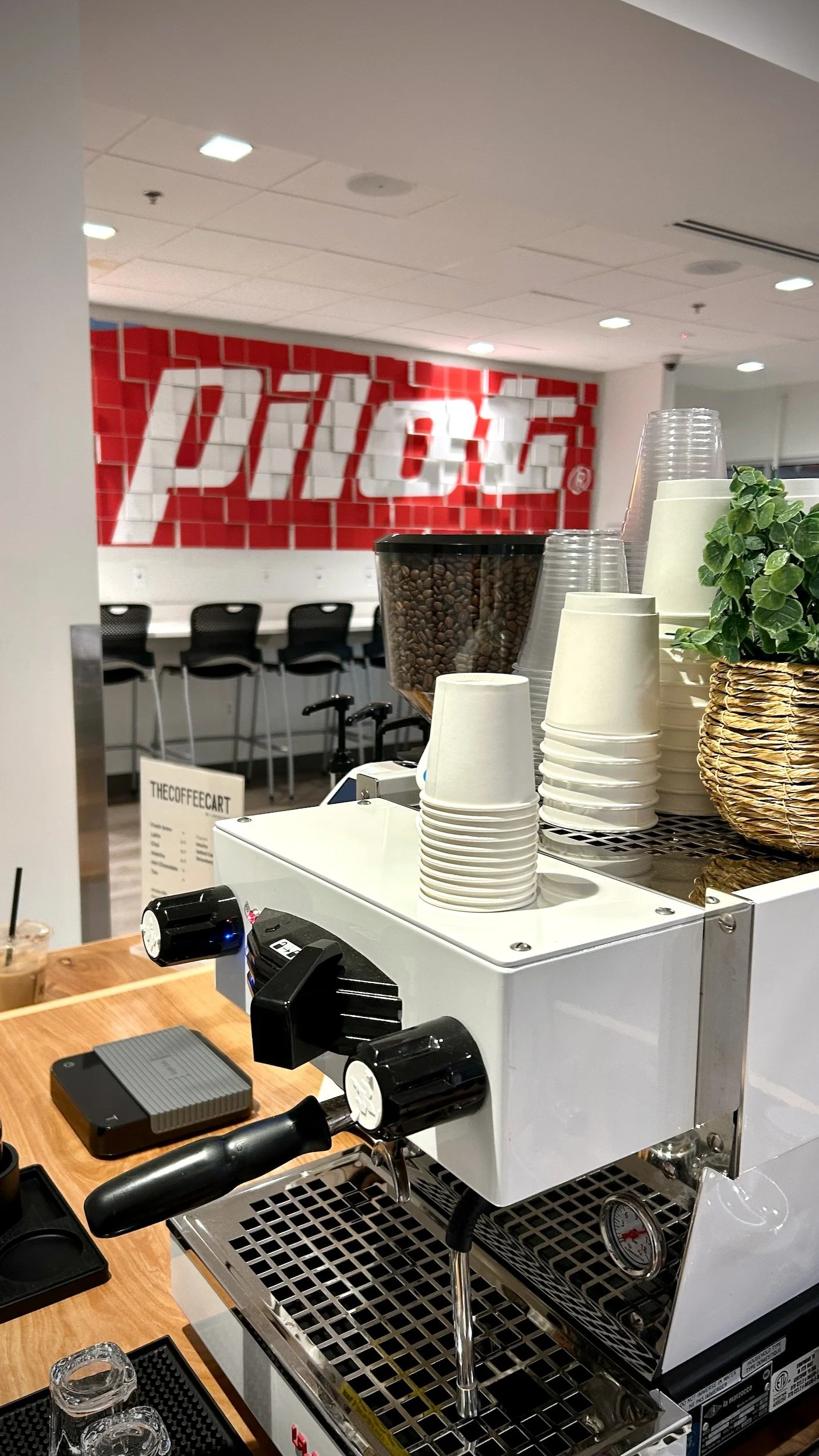 Espresso machine and coffee beans set up at The Coffee Cart's mobile espresso bar during a Pilot Flying J corporate event.