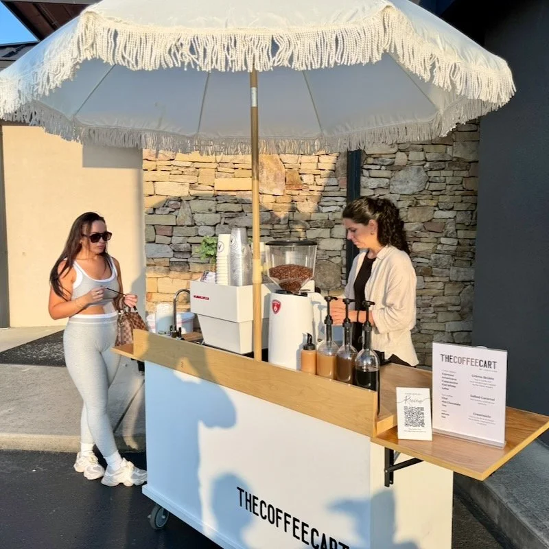 A woman gets coffee at a spa brand activation in Sevierville with The Coffee Cart.