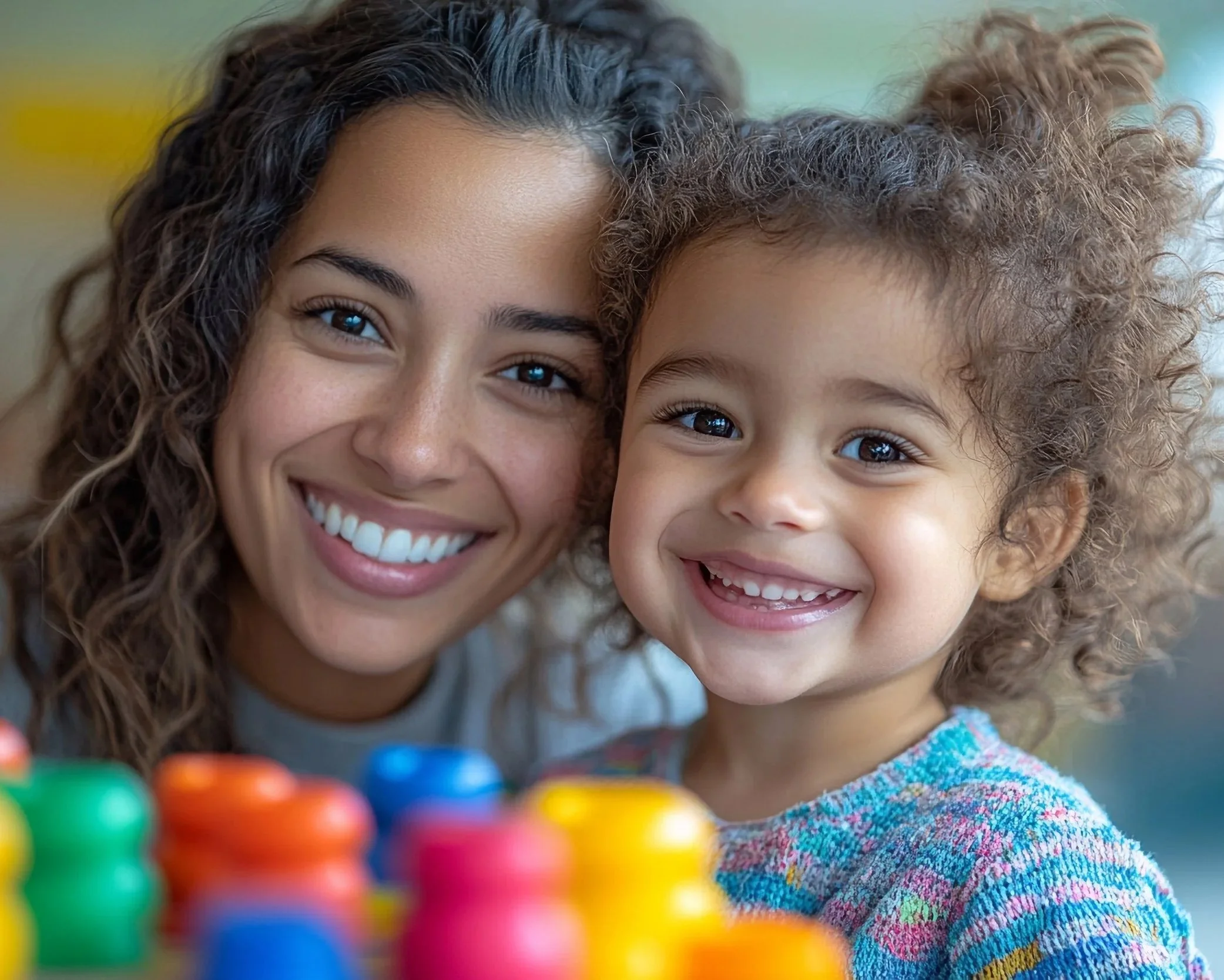 An SLP and young girl showing connection during child-led speech and language therapy session in-home in Rancho Santa Margarita, CA.