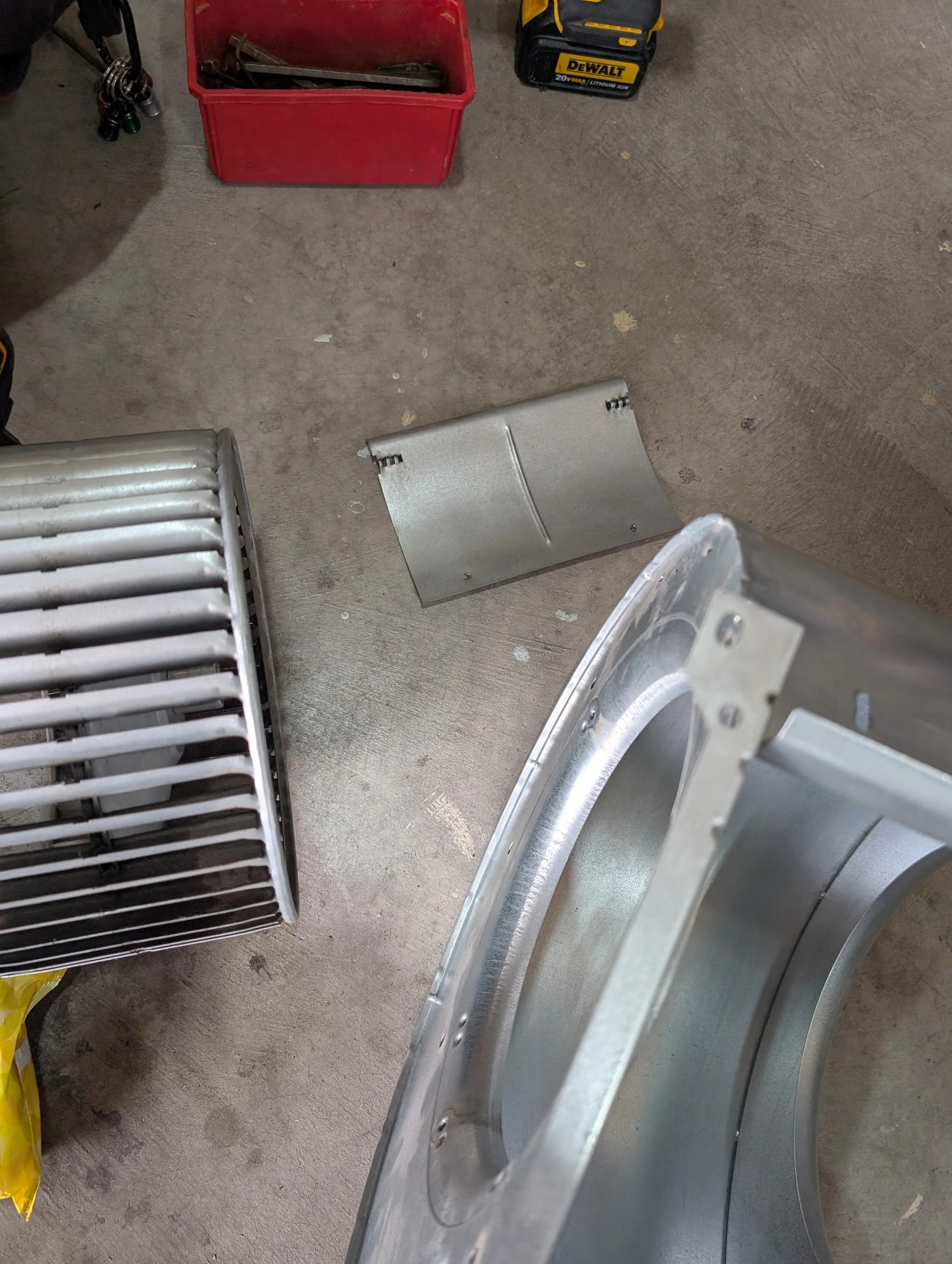 Components of a furnace blower compartment, piece by piece, cleaned and ready to install.