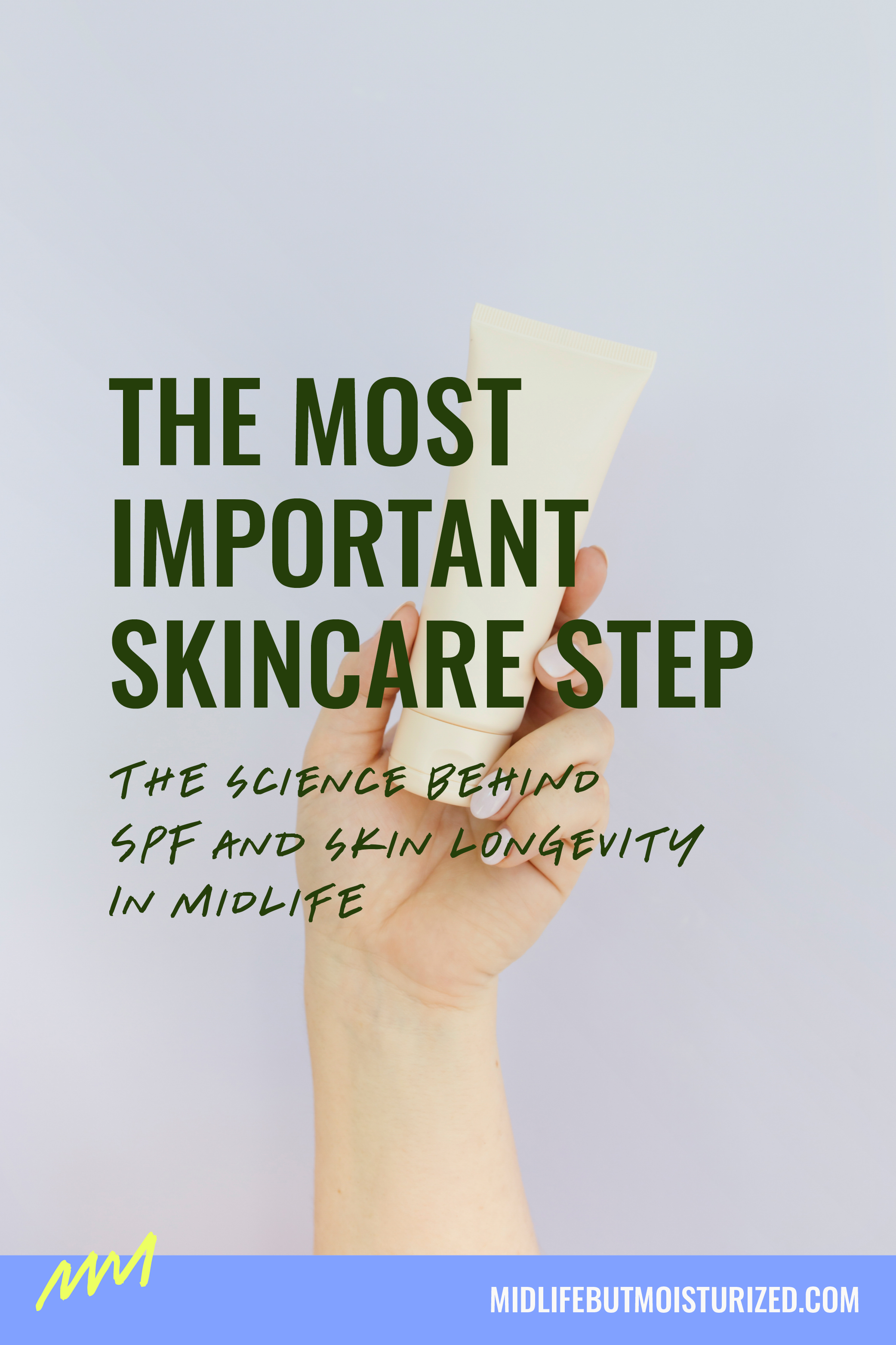 Hand holding a tube of sunscreen against a light background, representing SPF as a daily skincare essential