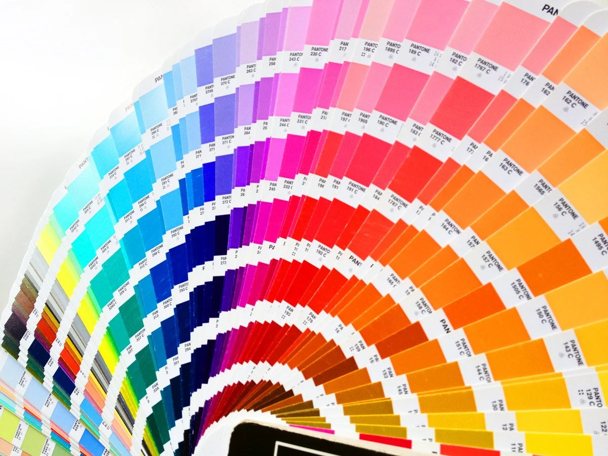 Color swatches arranged in a circular pattern, showing a gradient spectrum from blues to purples, reds, oranges, yellows, and browns.