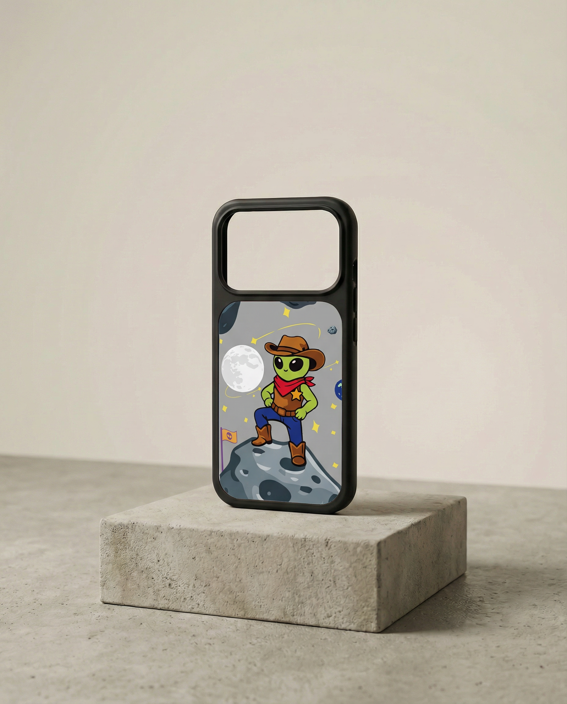 Phone case featuring a cartoon alien dressed as a cowboy, standing on a moon-like surface with planets and stars in the background.