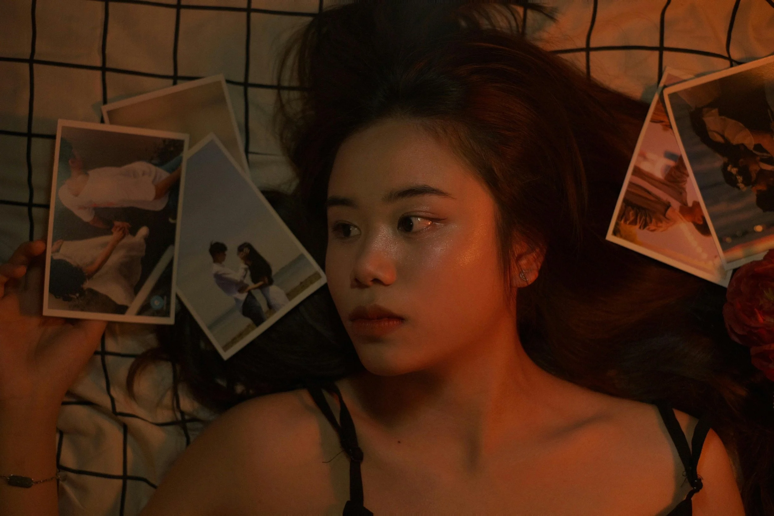 woman looking at breakup photos