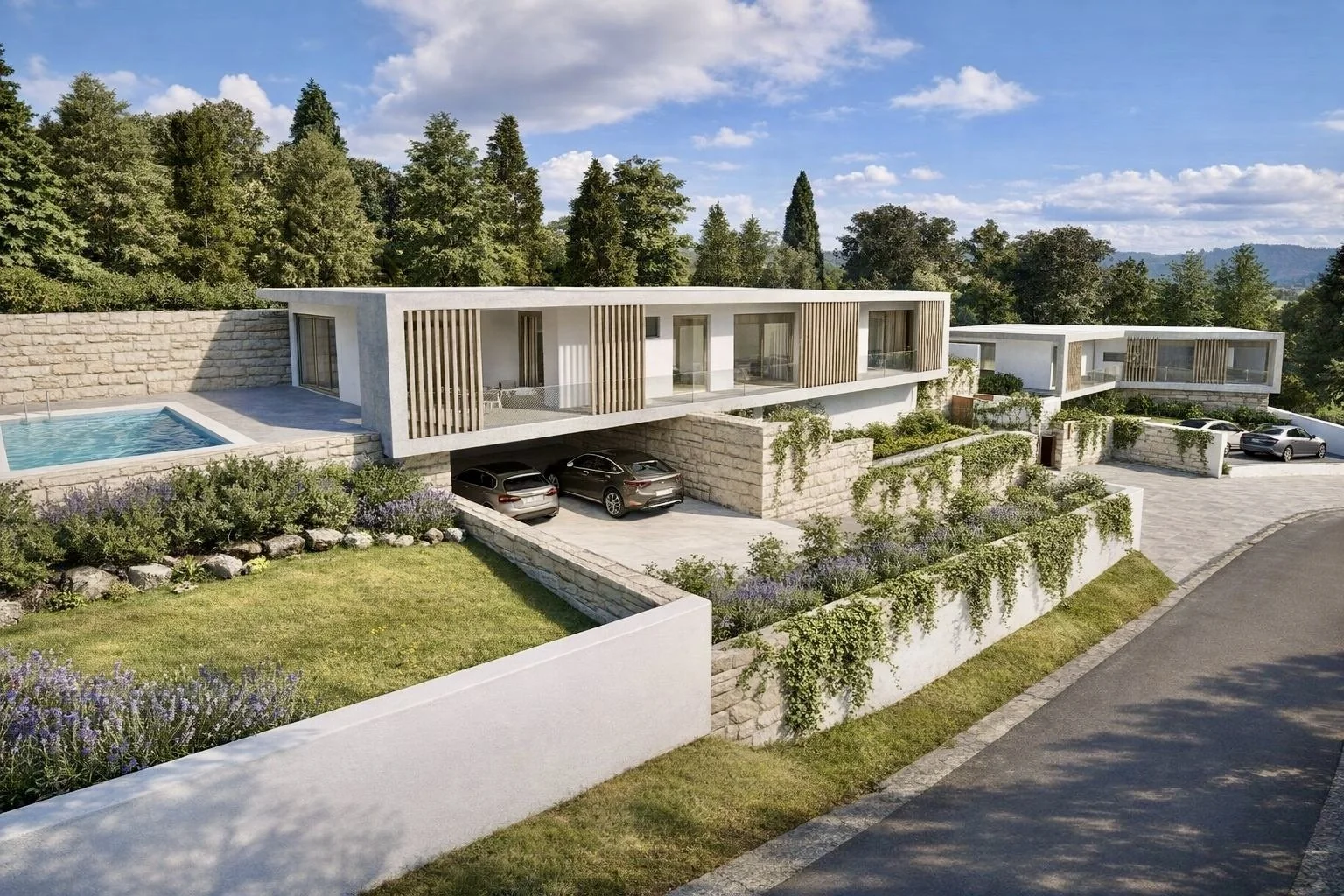 Conjunto de casas modernas com jardins, estacionamento e piscina, rodeadas por árvores e vegetação, sob céu com nuvens.