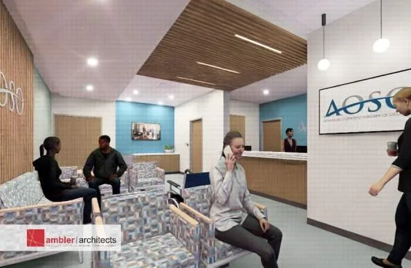 Rendering of the modern lobby of AOSO Ambulatory Surgical Center with seating area, reception desk, and people waiting, featuring wood accents and a large wall sign.
