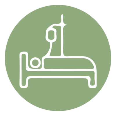 Hospital bed with medical equipment, including a monitor and IV drip, on a green circular background, representing End Of Life Counseling