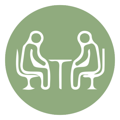 Illustration of two people sitting across from each other at a table, representing Geriatric Psychotherapy