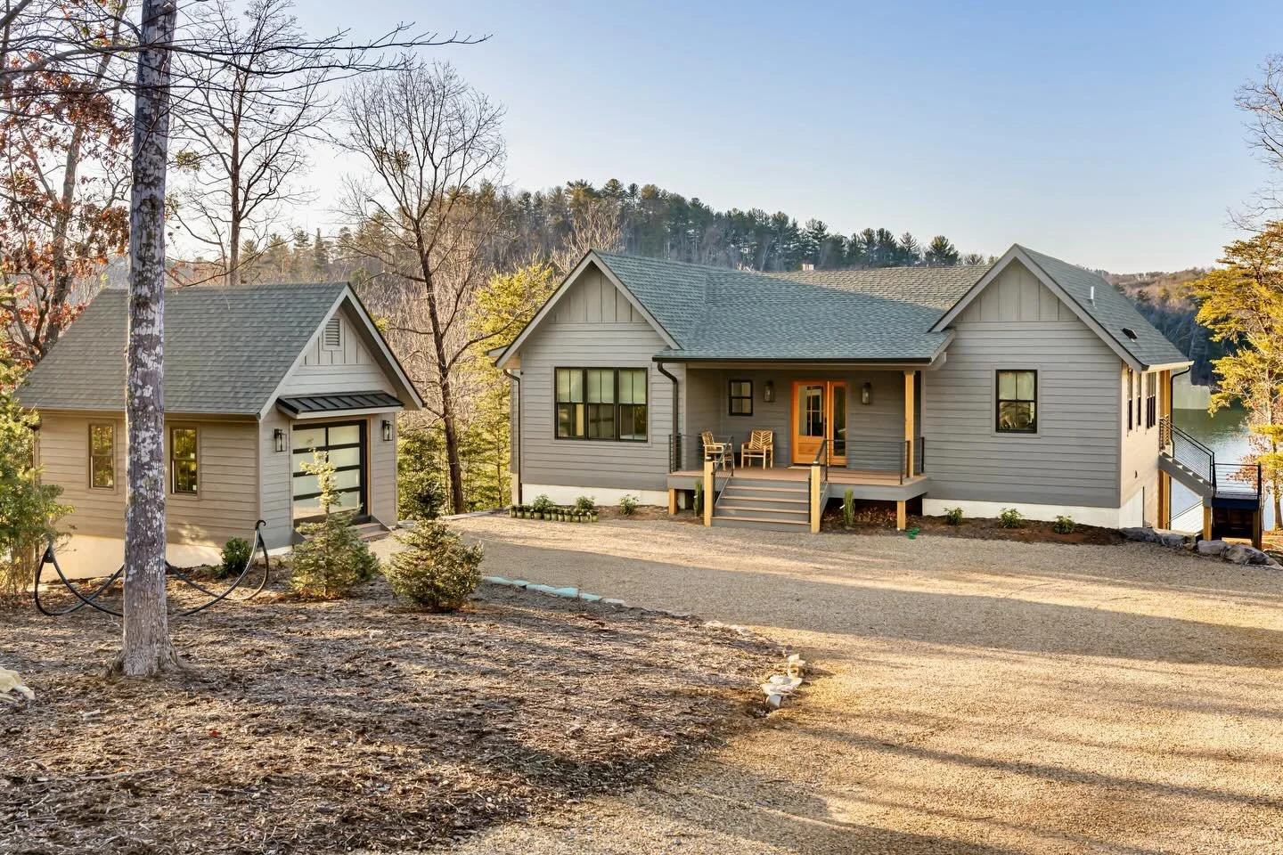 LHA designed a new vacation home in the Arbors at Lake James. The design is simple and efficient, but the house lives deceptively large with two primary suites on the main level and several bedrooms and a bunkroom below. The vaulted living space spil