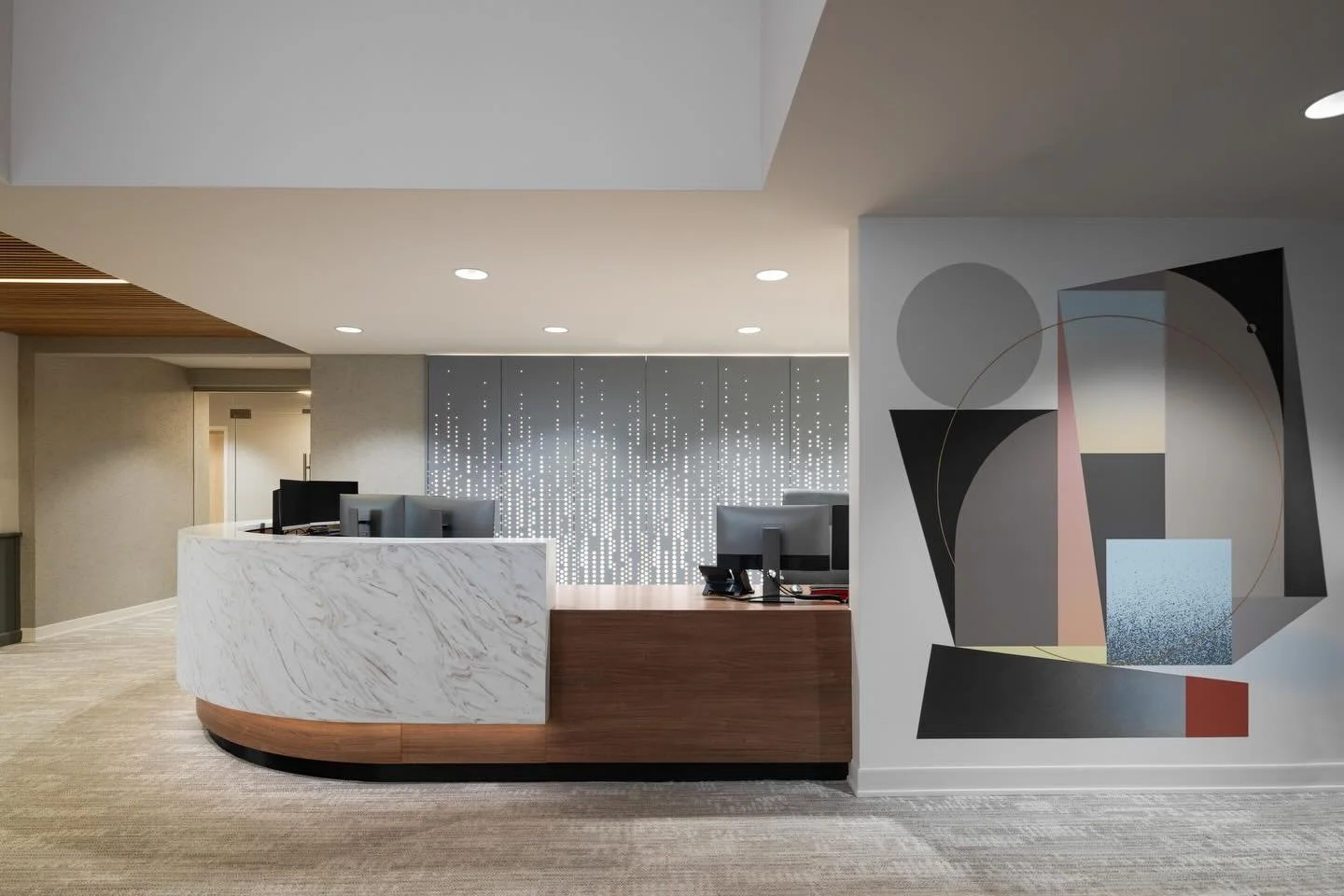Happy New Year! LHA recently completed the remodel of Asheville Oral &amp; Maxillofacial Surgery. This project highlights many interesting details including: @arkturallc perforated metal panels backlit by LED&rsquo;s, solid surface countertops by @me