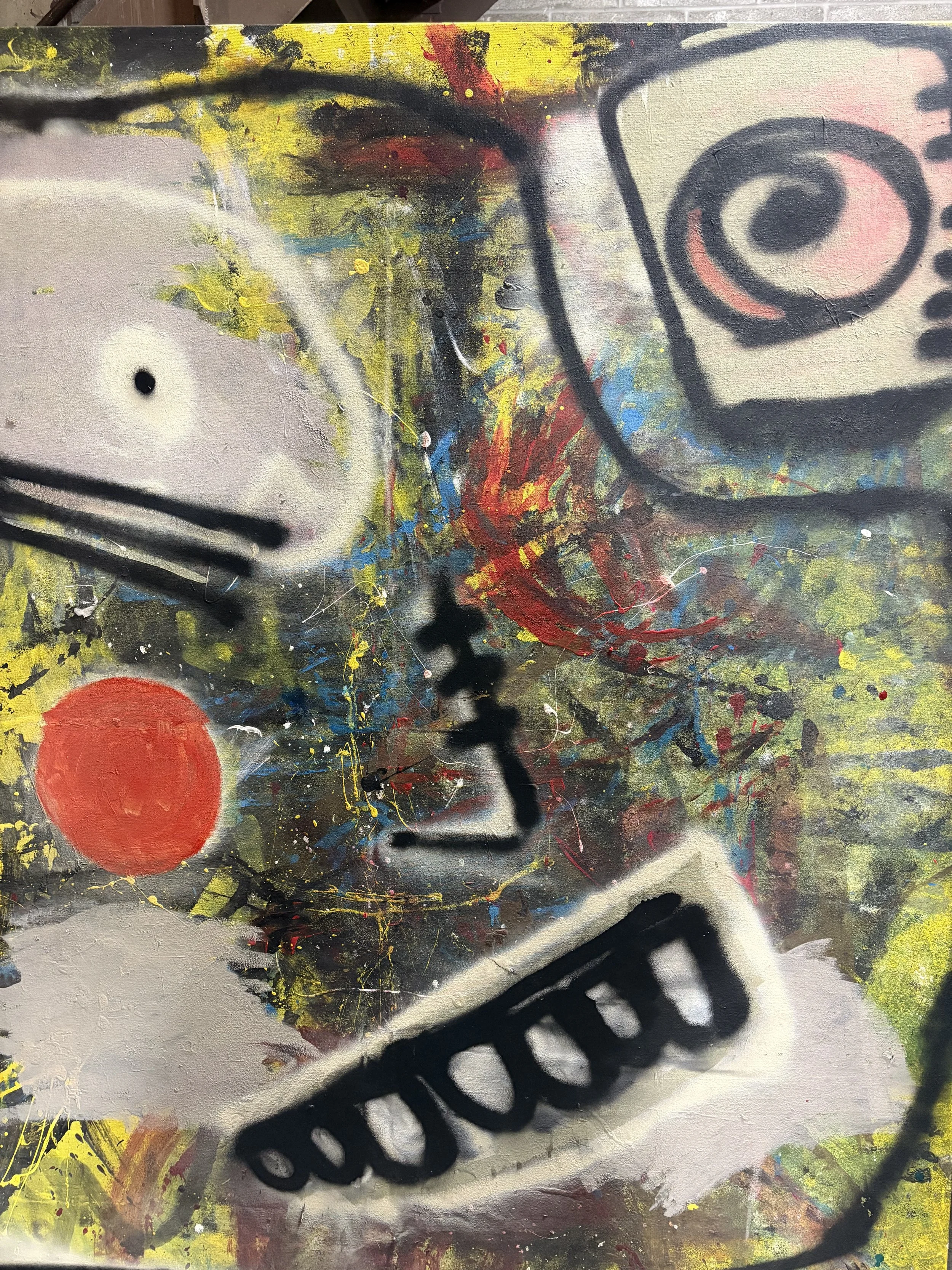 Abstract graffiti art with colorful splashes, black spray paint outlines, and various shapes including a red circle and spiral patterns.