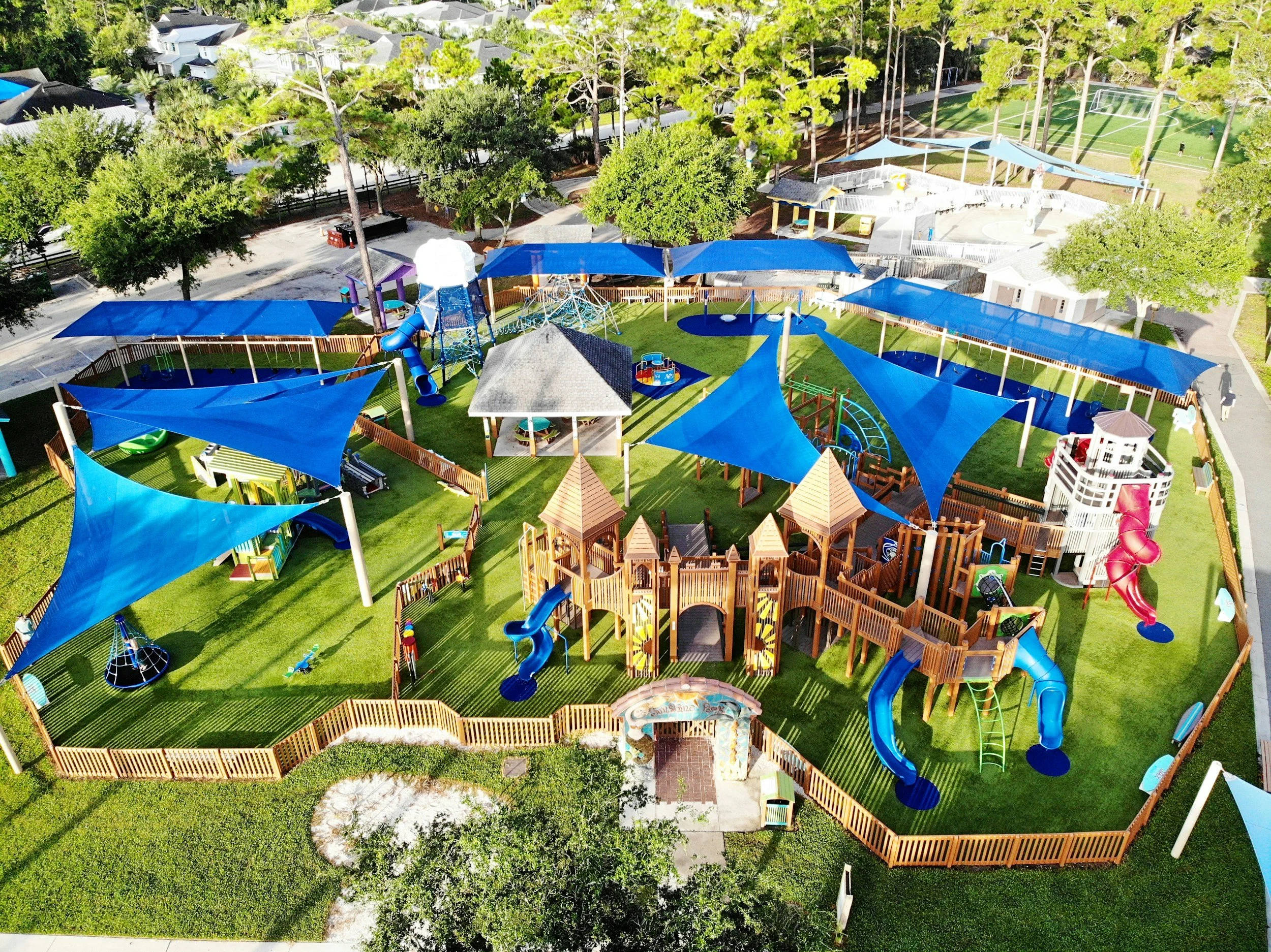 enclosed playground with soccer field