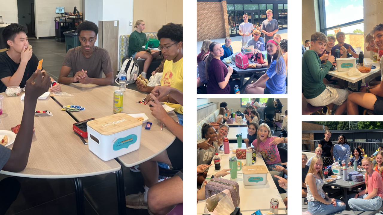 students playing cards and talking during lunch with their phones away
