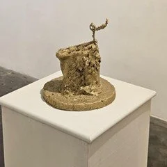 Untitled. Concrete, acrylic, wood, metal wire, and leather. 9” x 10” 